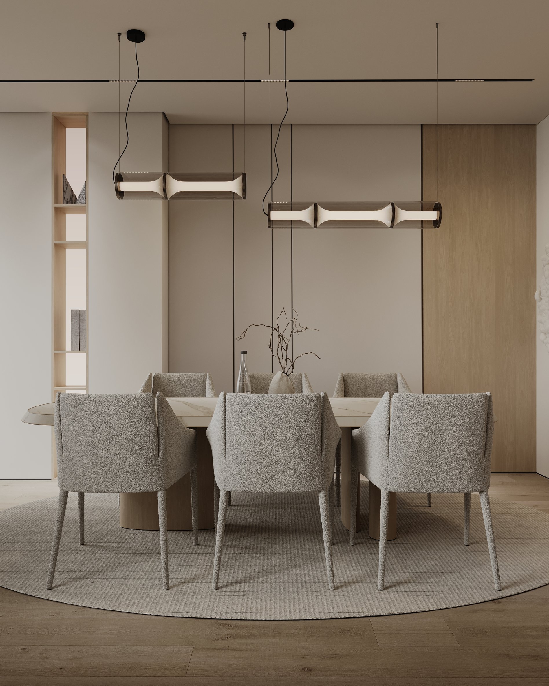 Modern dining area with upholstered chairs, cylindrical pendant lights, and built-in shelving.