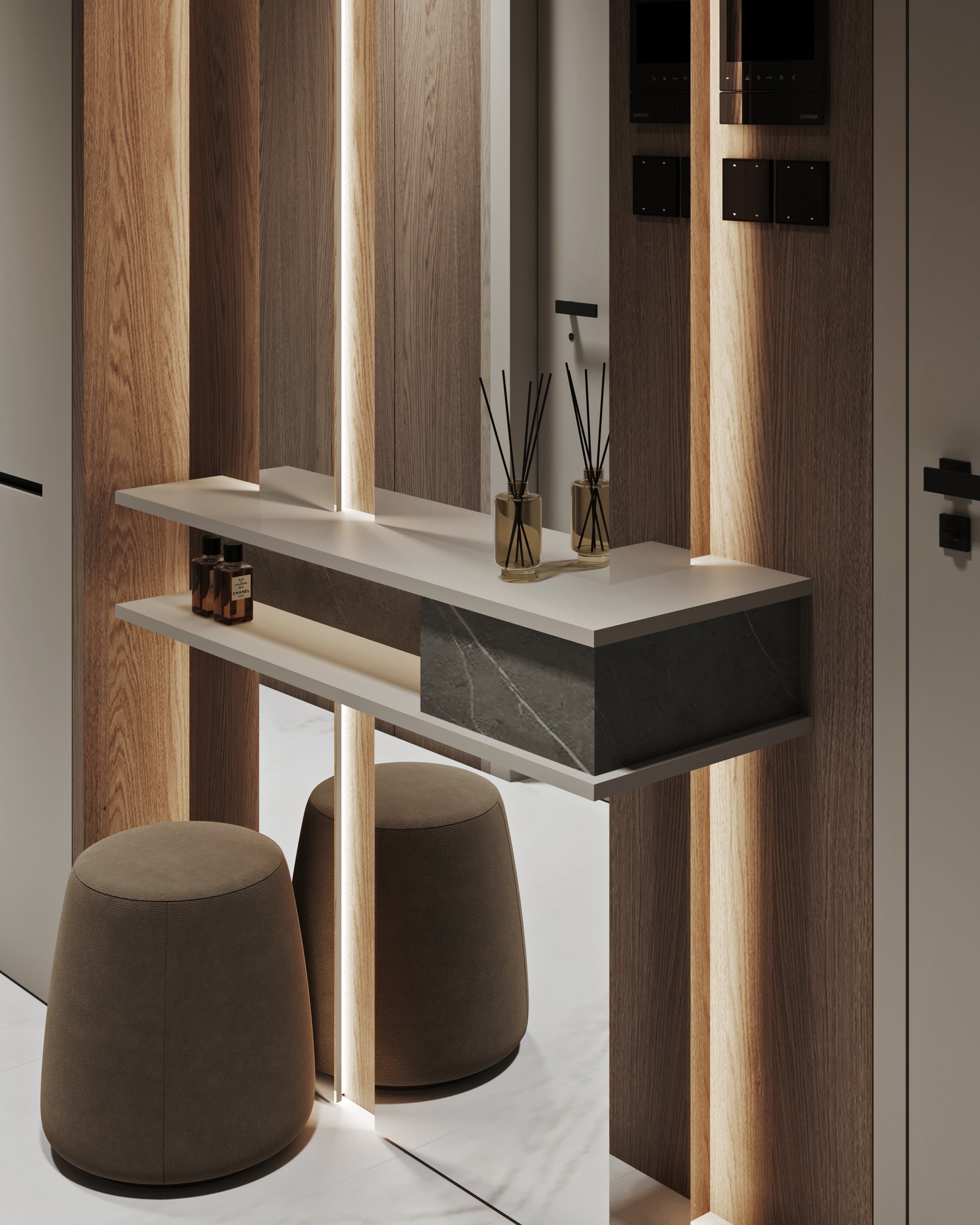 Detail of entryway console with decorative items and integrated lighting features.