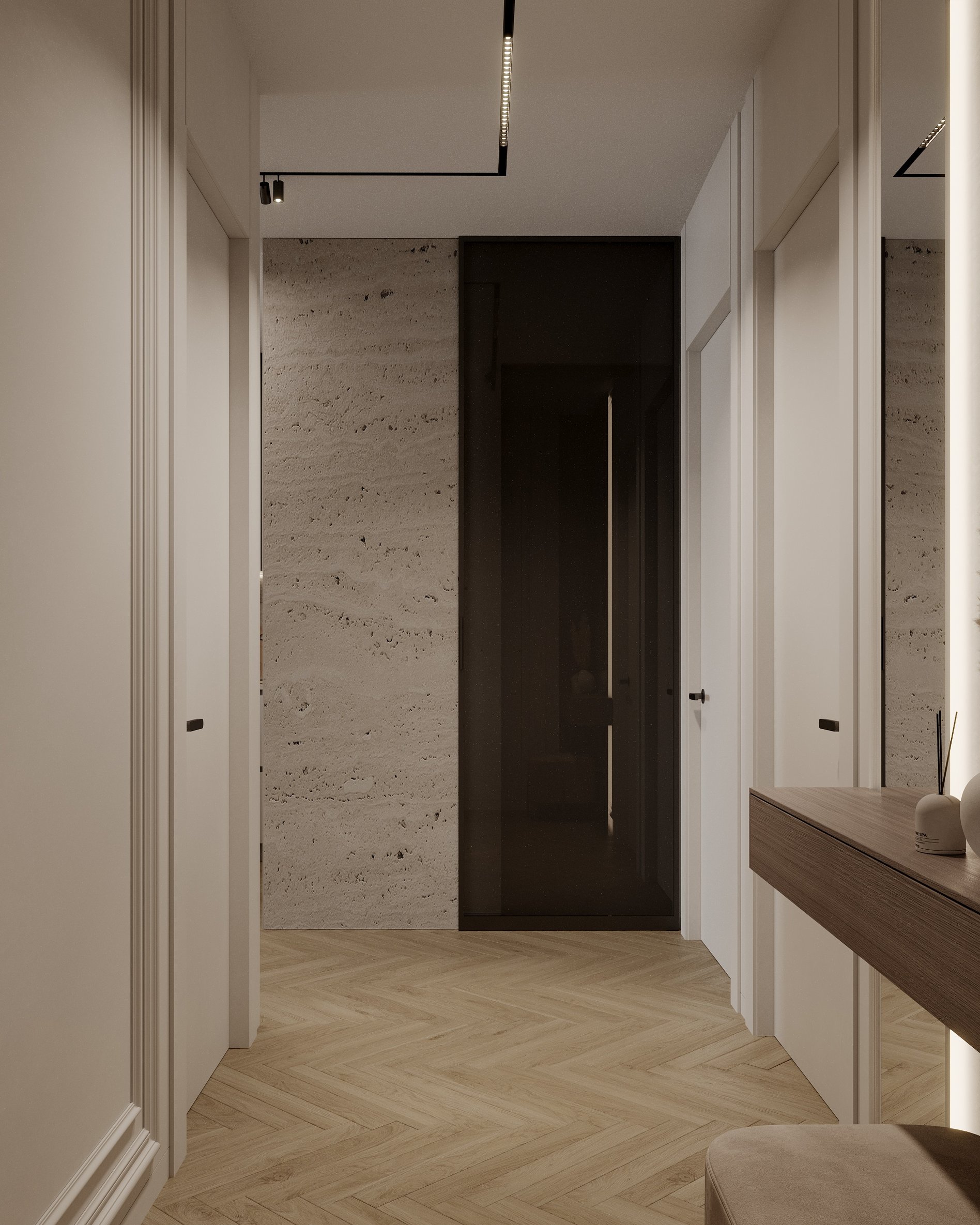 Contemporary hallway with herringbone flooring, textured stone wall, and integrated lighting.