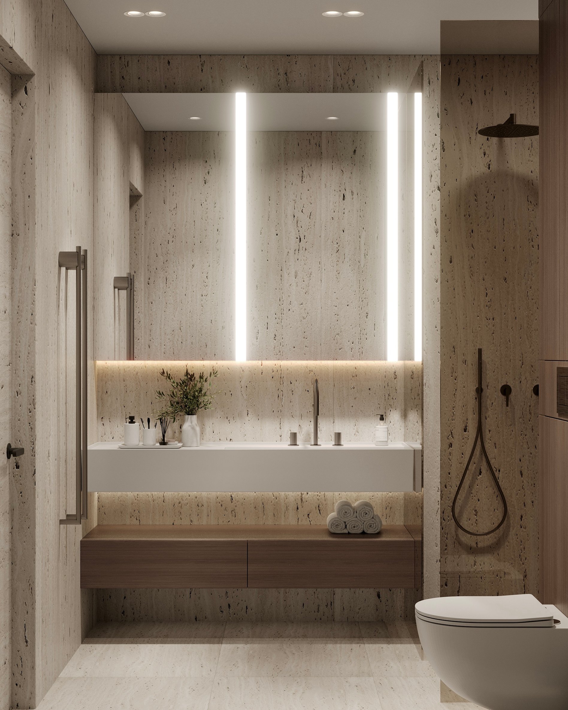 Luxury bathroom featuring travertine walls, floating vanity, and modern fixtures with LED lighting.