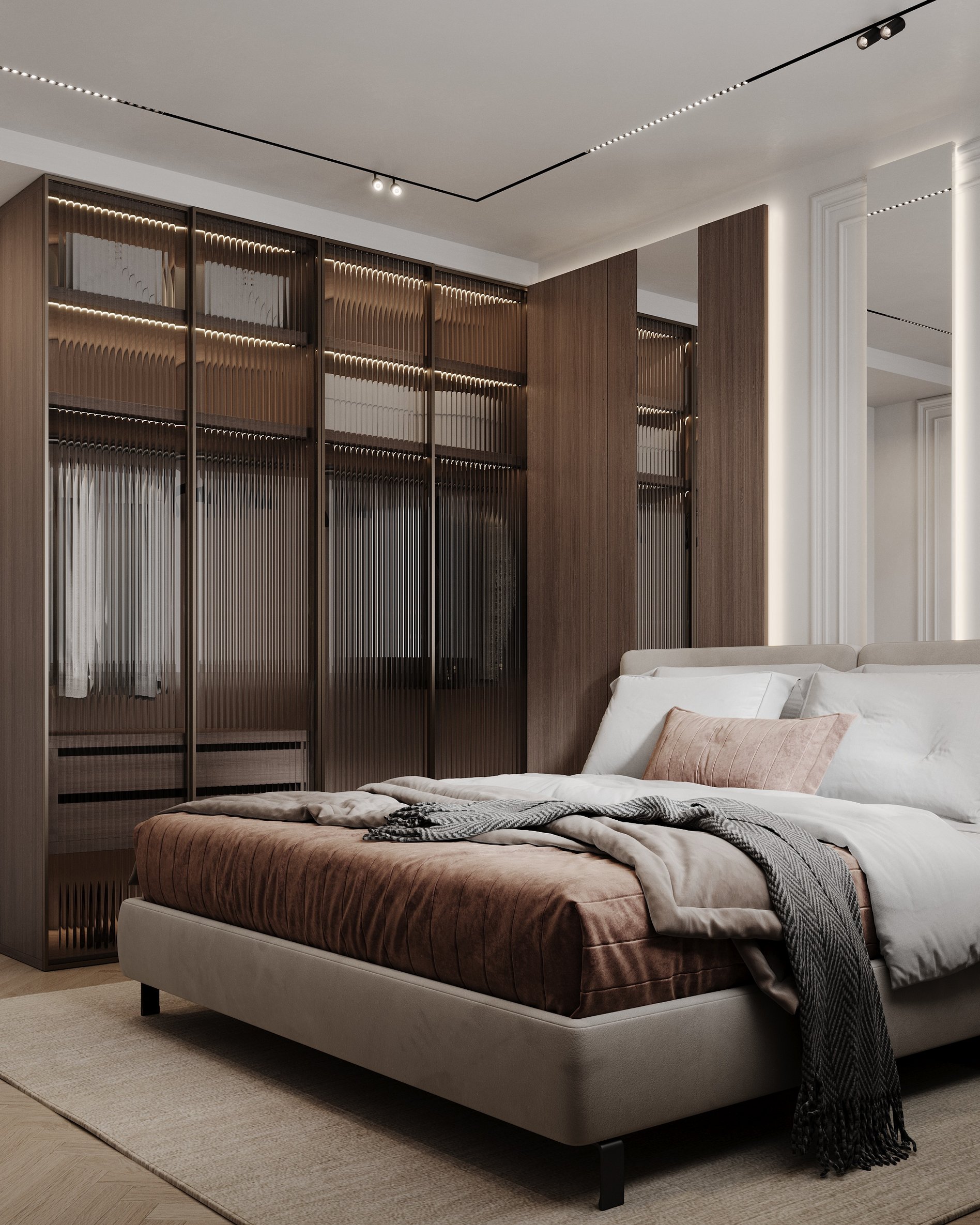 Master bedroom with illuminated glass wardrobes, wooden panels, and upholstered platform bed with textured bedding.