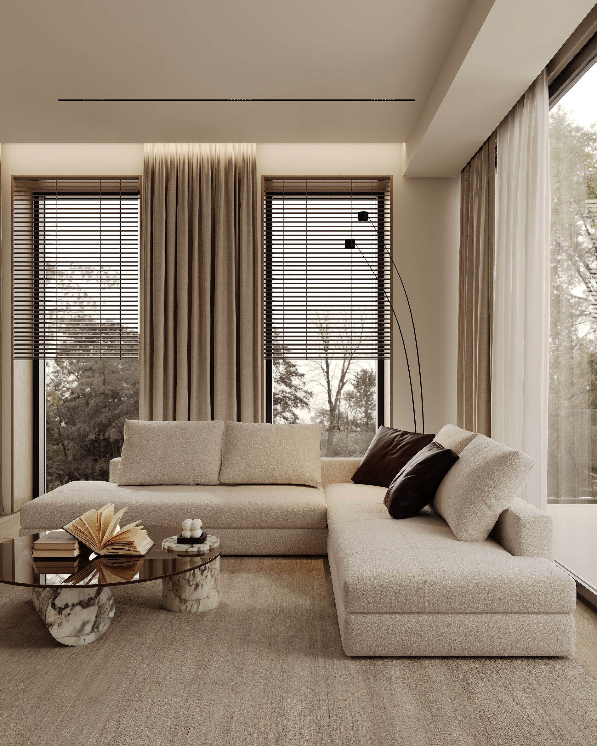 Modern living area with an L-shaped sofa, marble coffee table, and floor-to-ceiling windows with natural light and soft curtains.