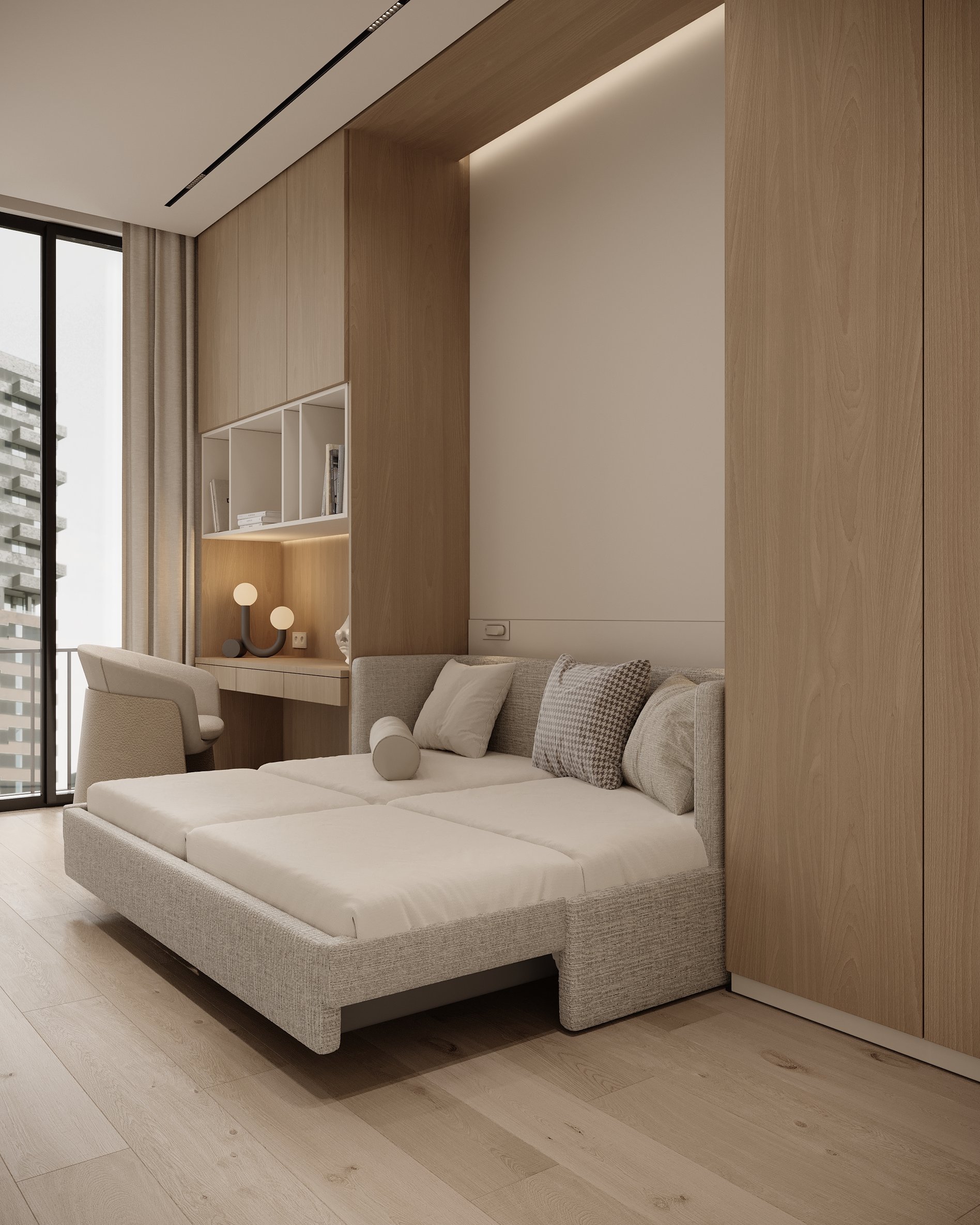 Guest room with a convertible sofa bed, built-in storage, and natural light from large windows.