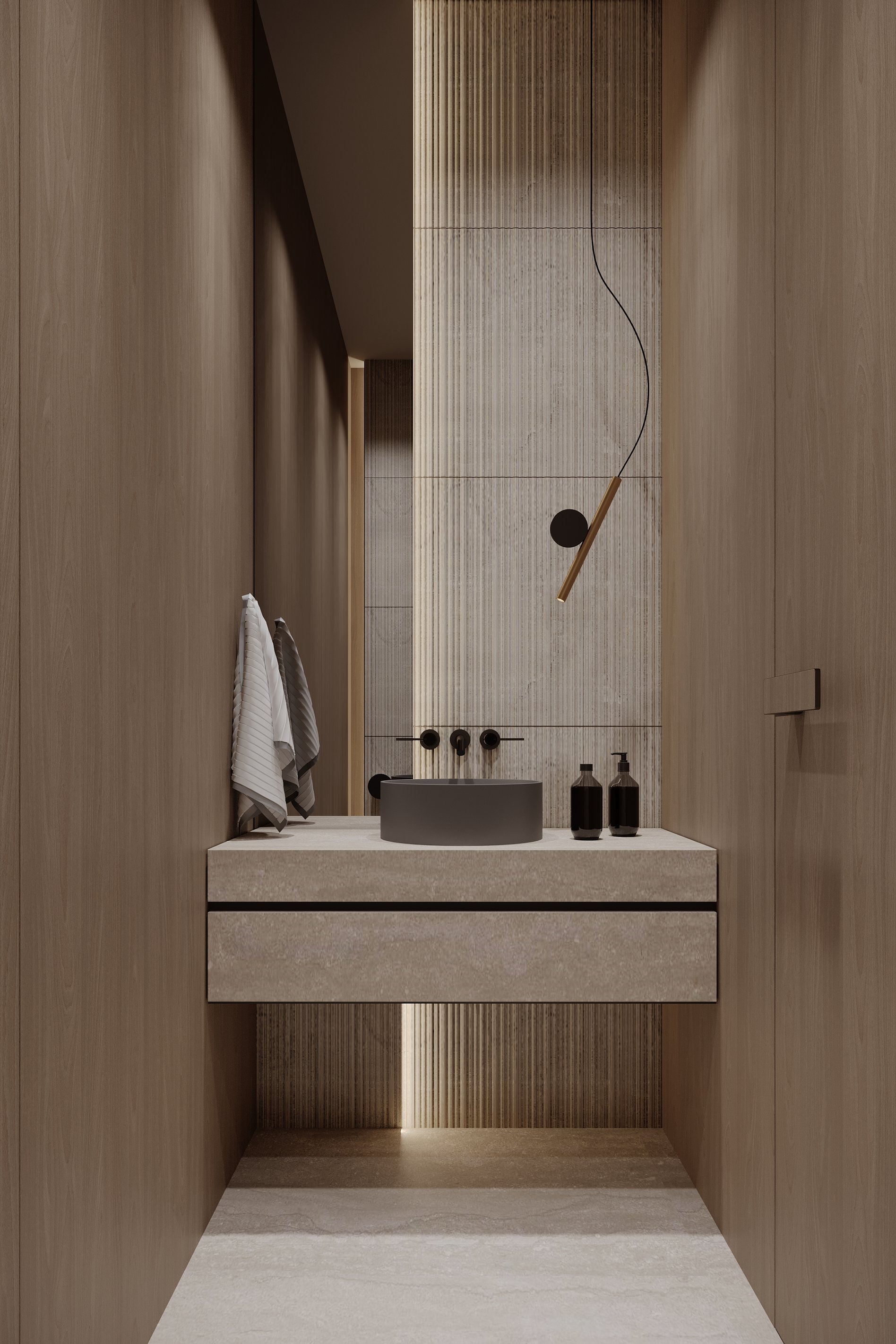 Minimalist powder room with a floating stone vanity, cylindrical vessel sink, ribbed wall detail, and modern pendant lighting.