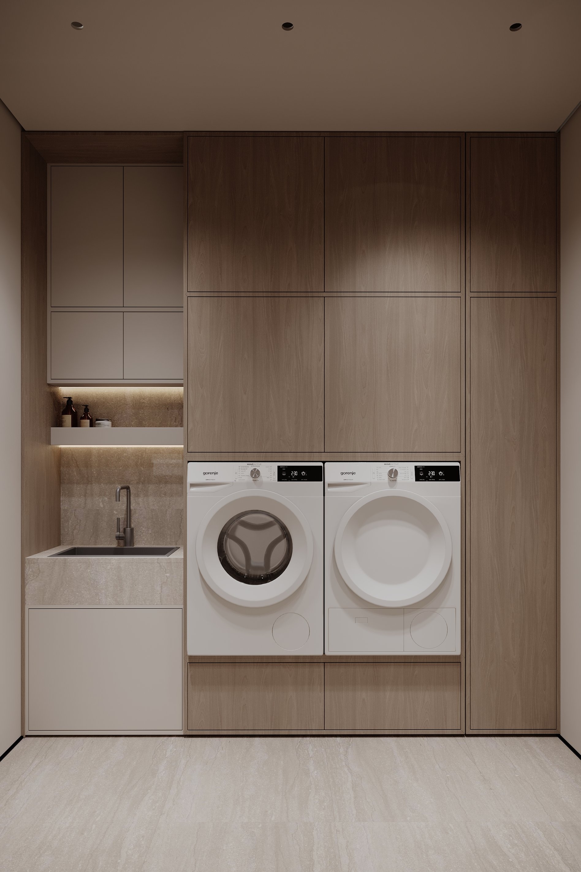 Modern laundry room with built-in washer and dryer, stone countertop, integrated sink, and ample wood cabinetry.