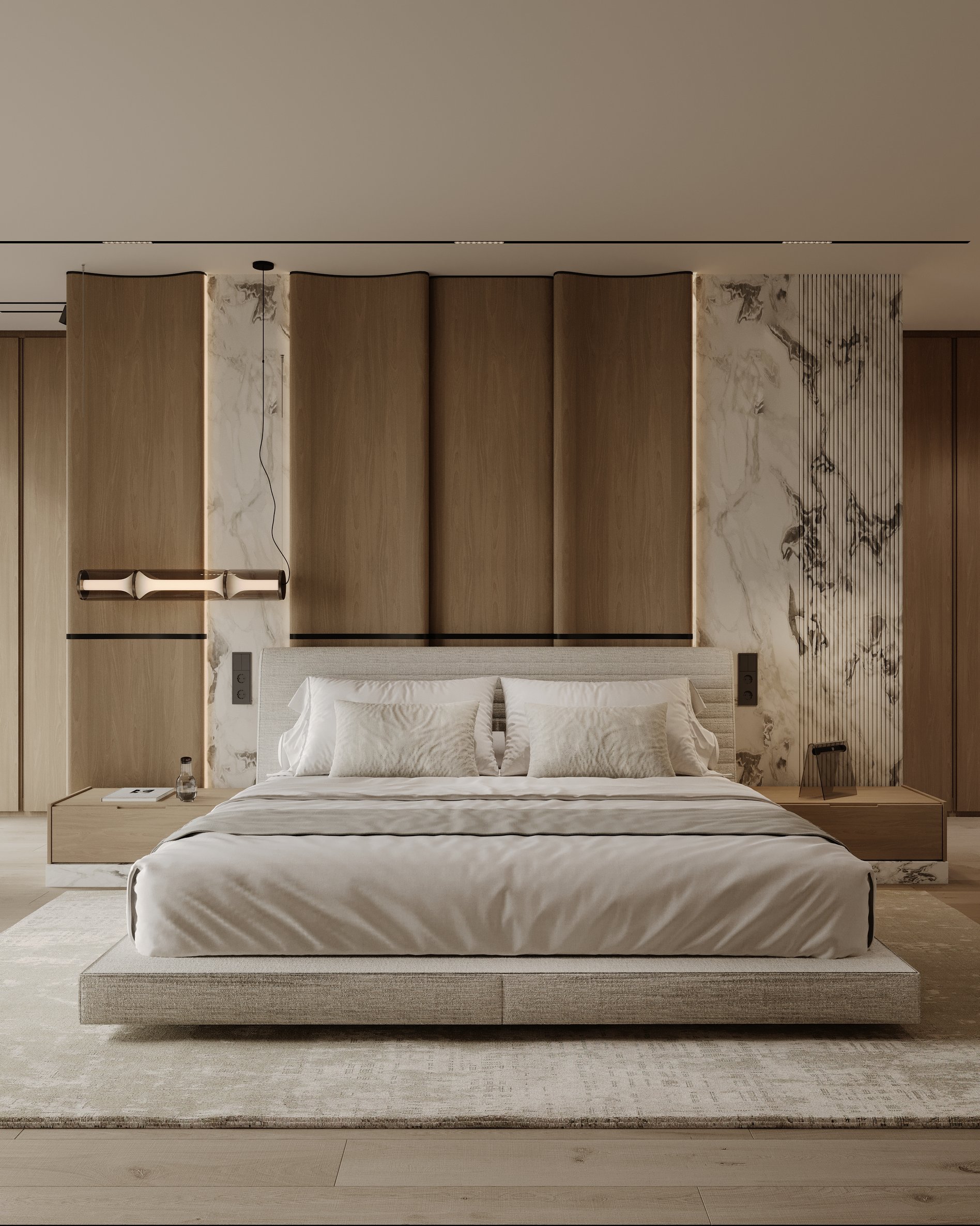 Master bedroom with upholstered bed, sculptural pendant light, and a feature wall combining wood panels and marble.