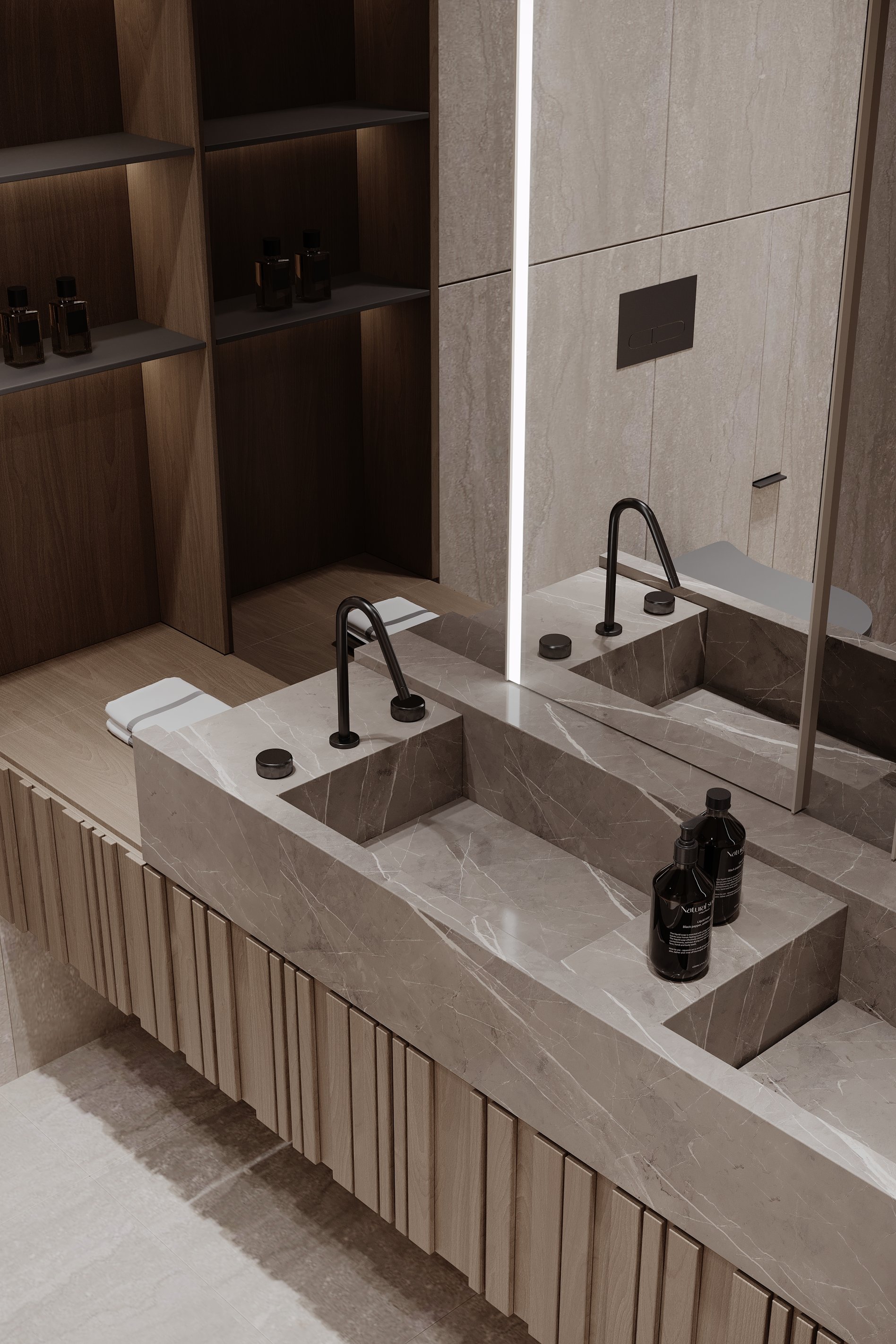 Detail of marble double sink vanity with integrated black faucets and illuminated shelving in a modern bathroom.
