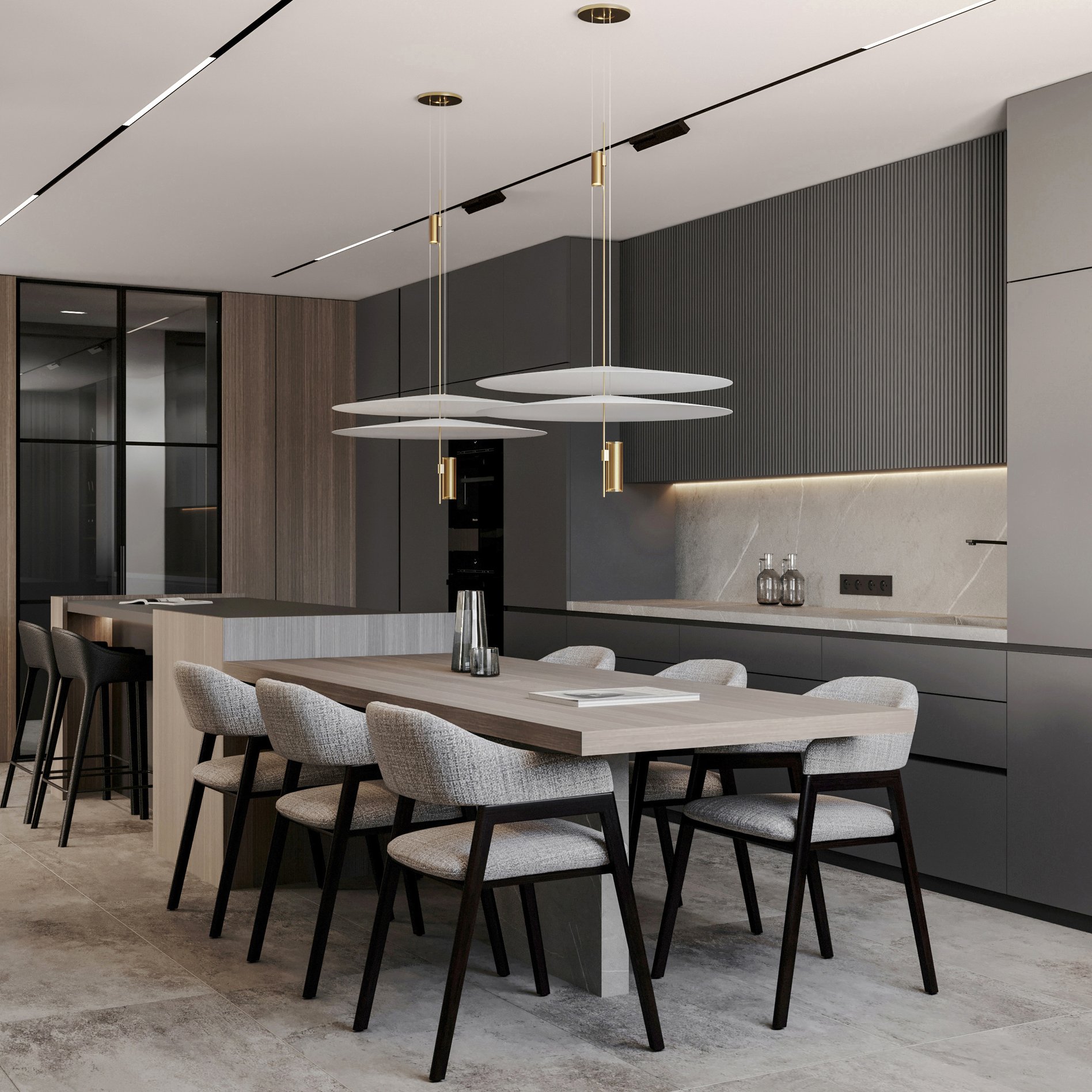 Dining area with wooden table, upholstered dining chairs, and modern disc-shaped pendant lights with brass accents.
