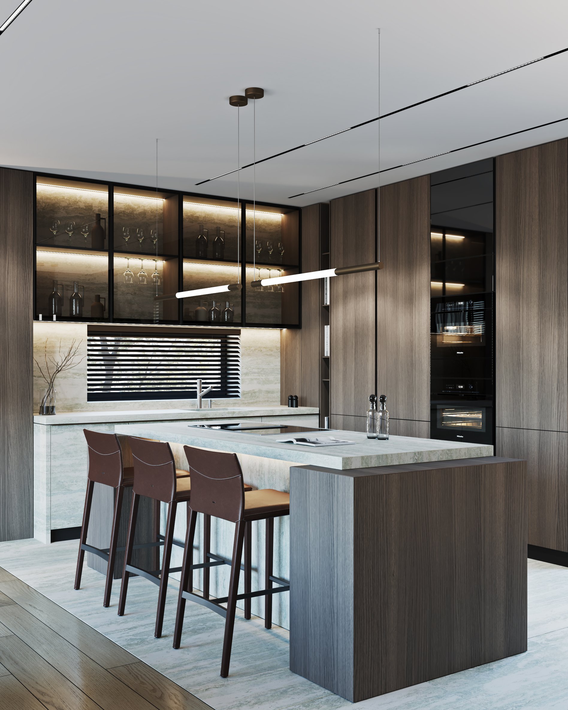 Kitchen counter detail with marble surfaces, leather bar stools, and linear pendant lighting.