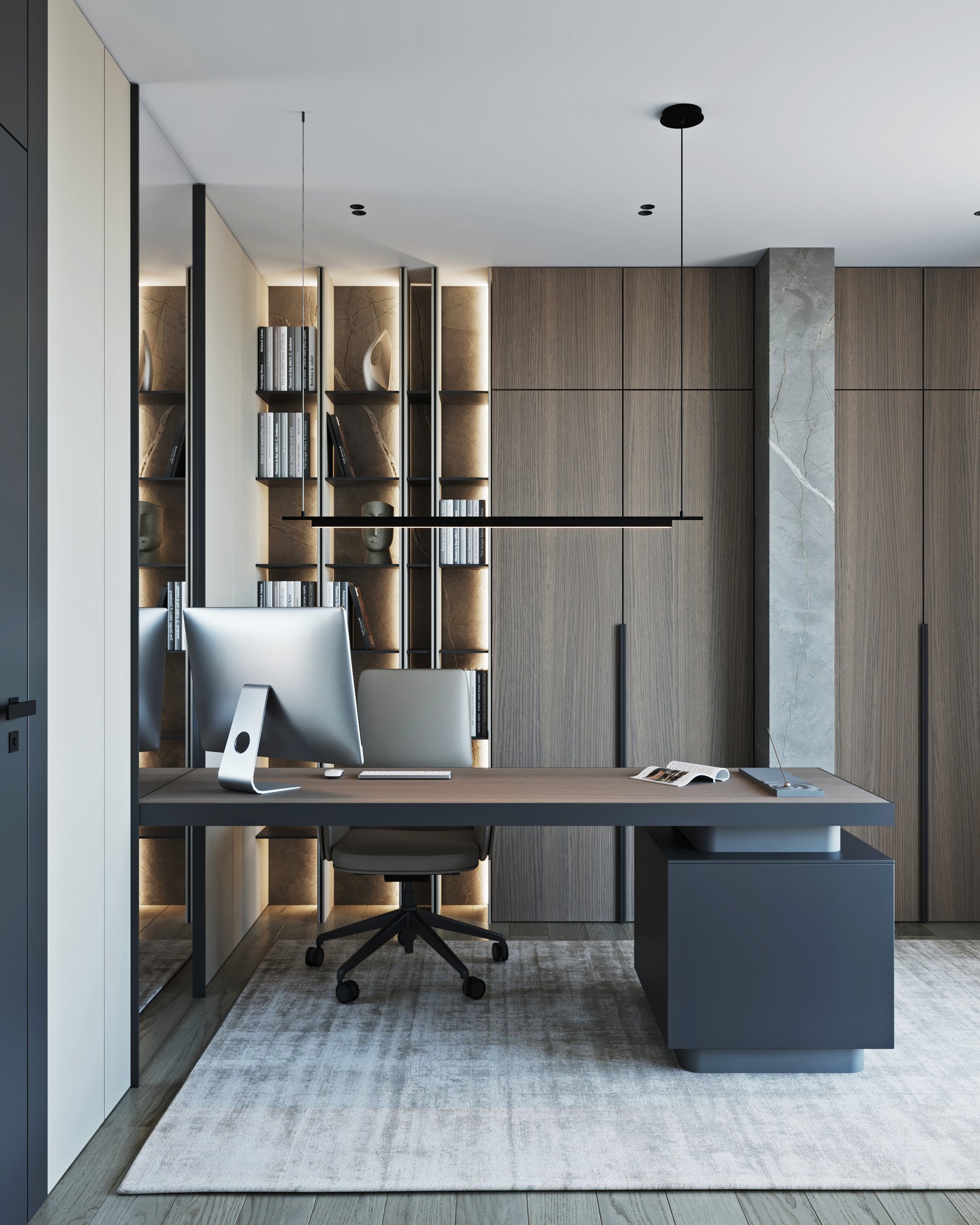 Modern home office with illuminated built-in shelving, grey desk, and ergonomic chair on light carpet.