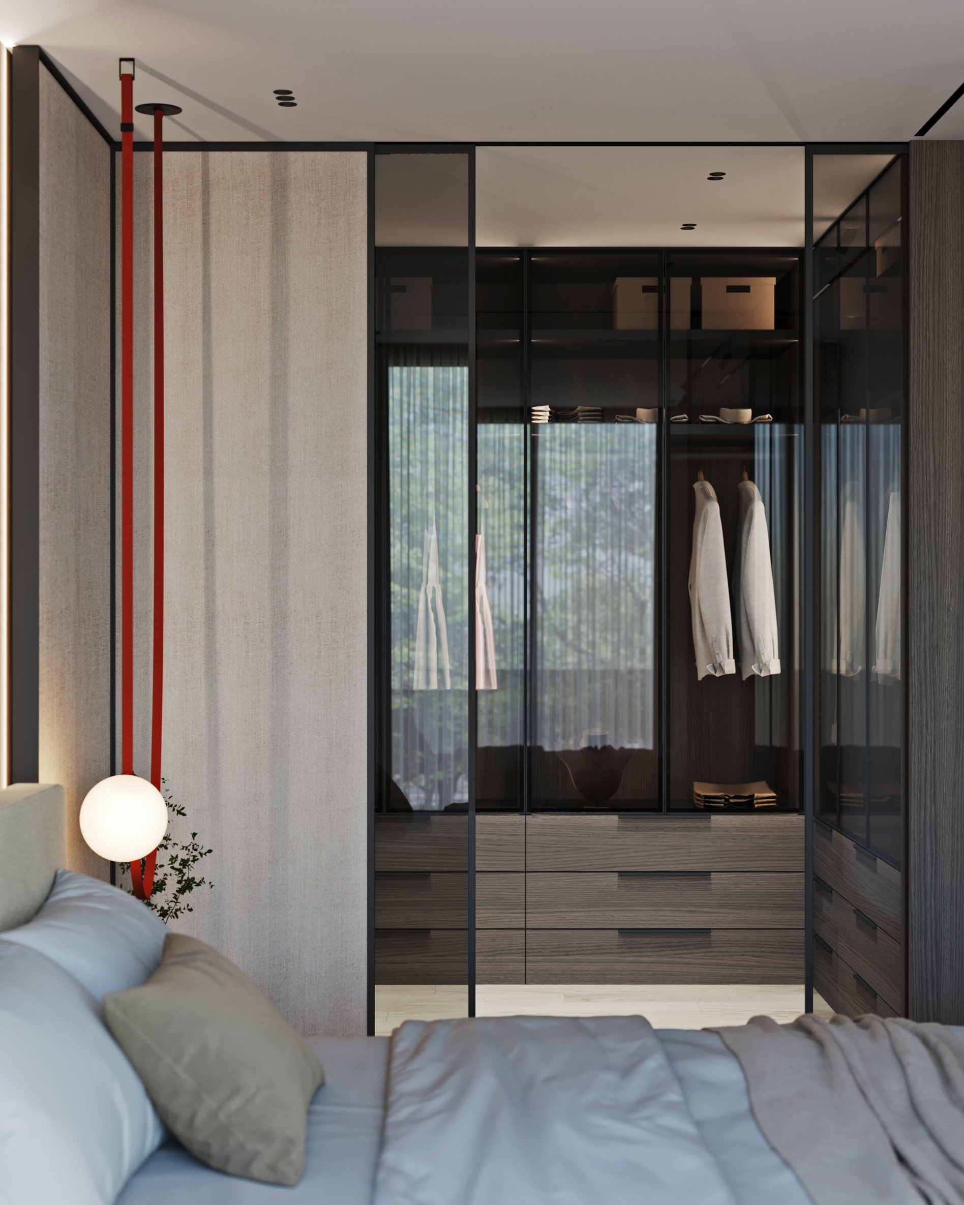 Detailed view of walk-in closet with glass doors, wooden drawers, and organized clothing display.
