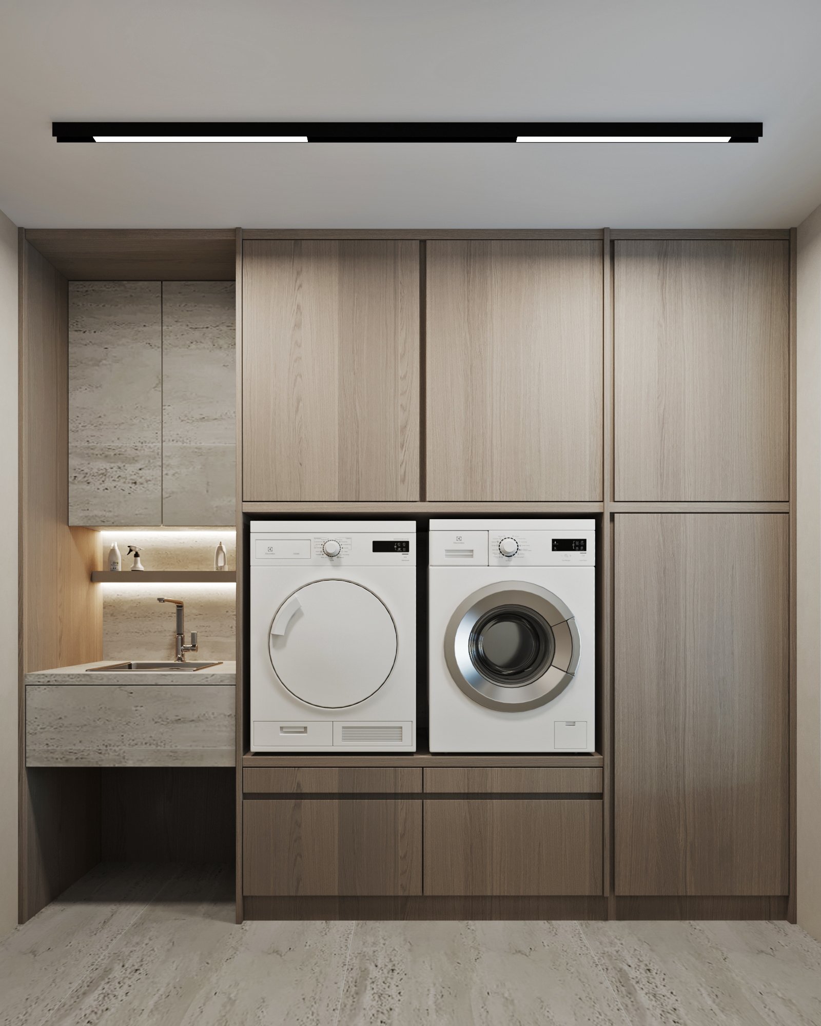 Built-in laundry room featuring elevated washer and dryer, marble sink, and floor-to-ceiling storage cabinets.