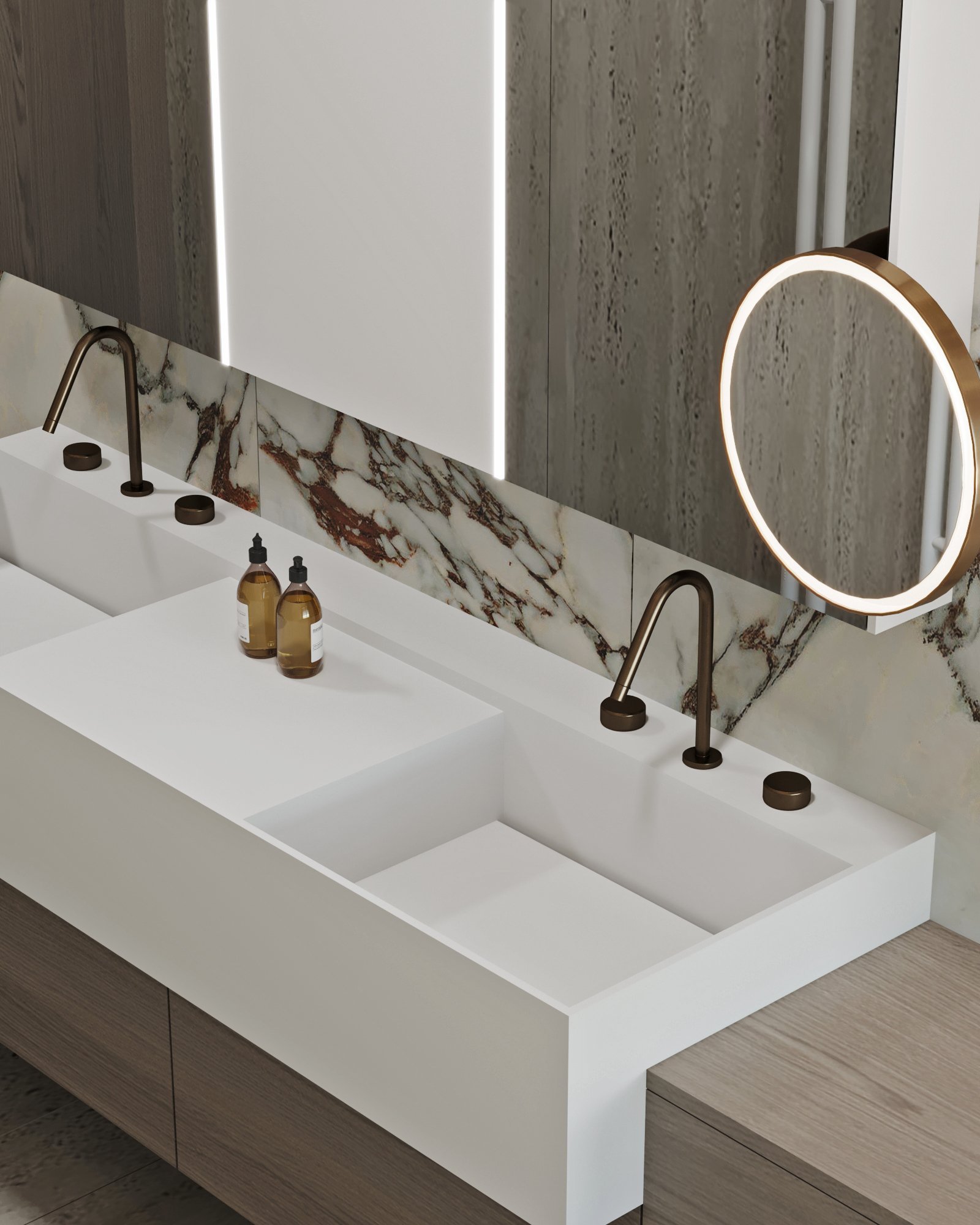 Detail of bathroom vanity showing white Corian sinks, bronze fixtures, and marble backsplash with amber veining.