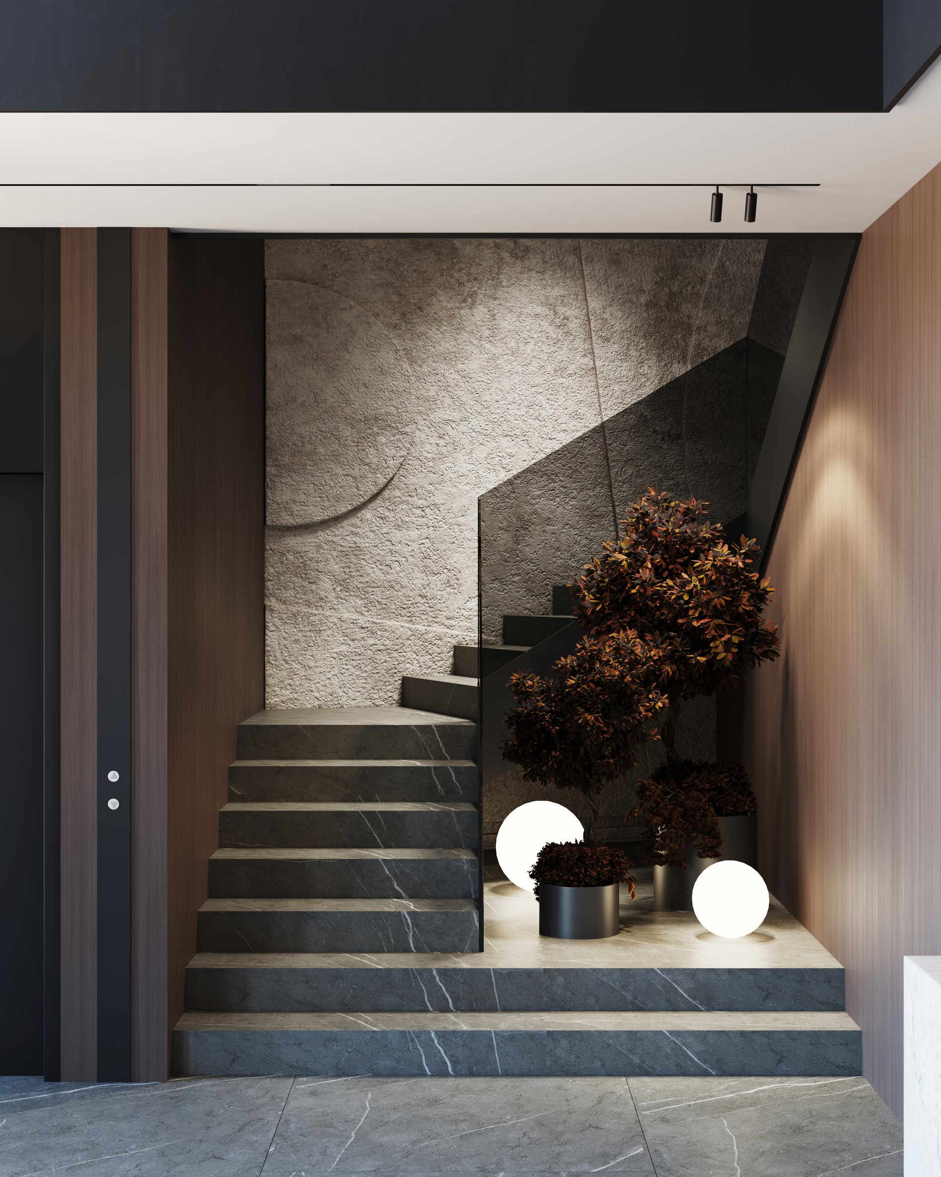 Contemporary staircase with textured white walls, black marble steps, and decorative sphere lighting.