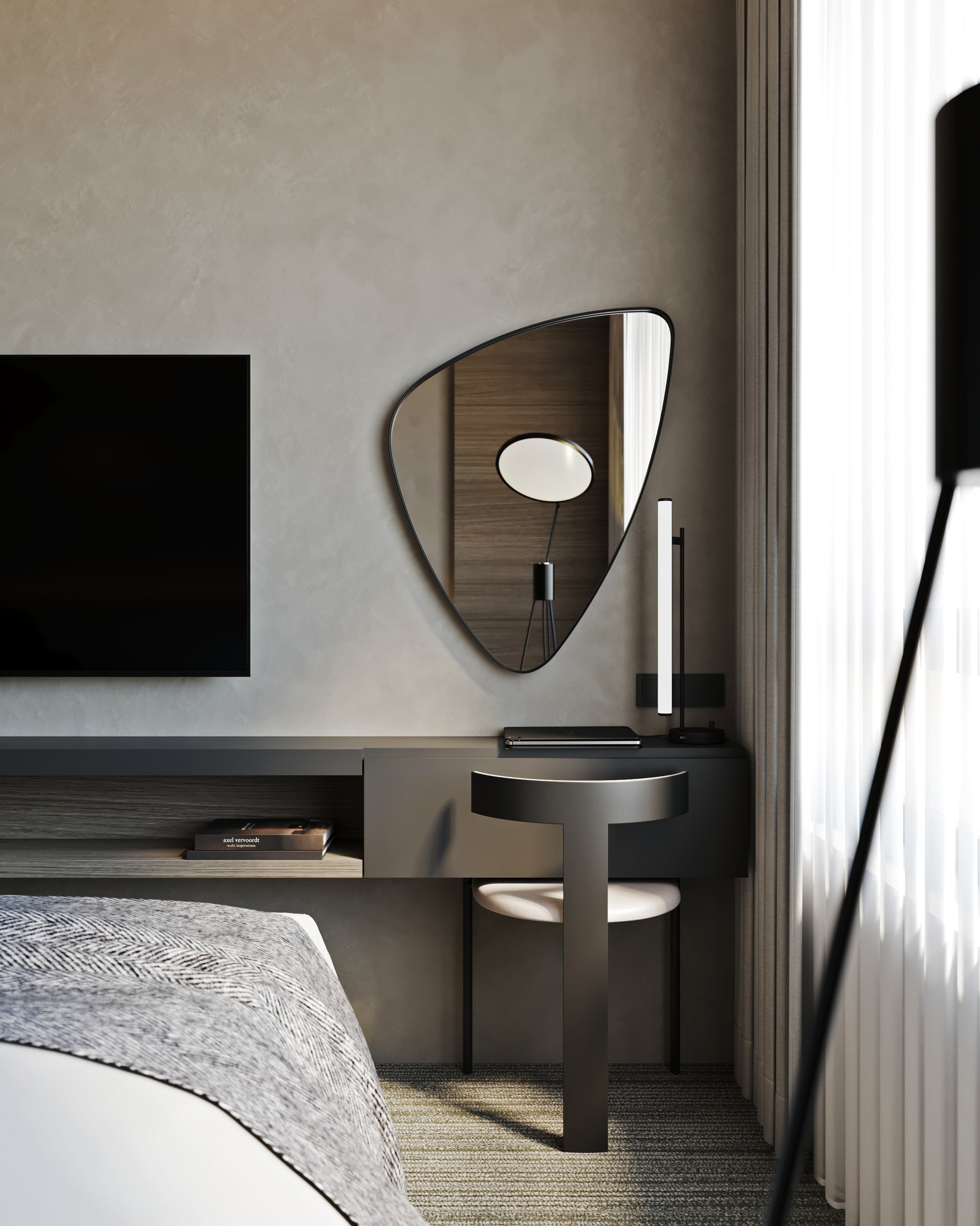 Hotel room workspace featuring geometric mirror, custom desk, and contemporary chair.