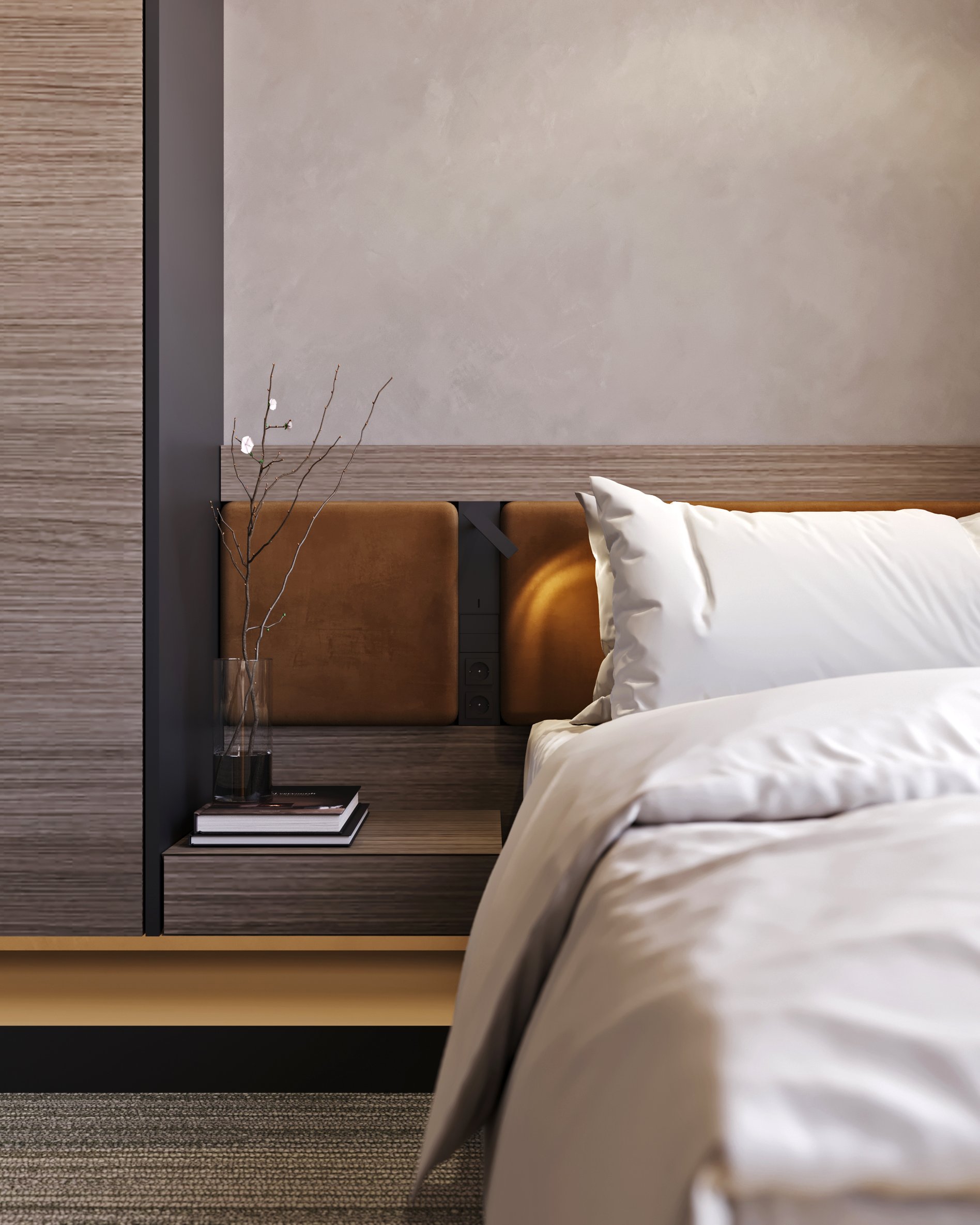 Detail of hotel room bedside area with wooden panels, leather headboard cushions, and minimalist decor.
