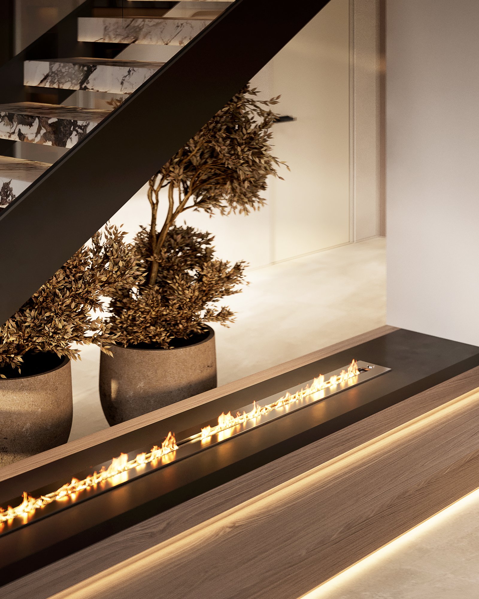 Close-up of linear gas fireplace with wooden platform, decorative plants in black planters, and marble stair treads.