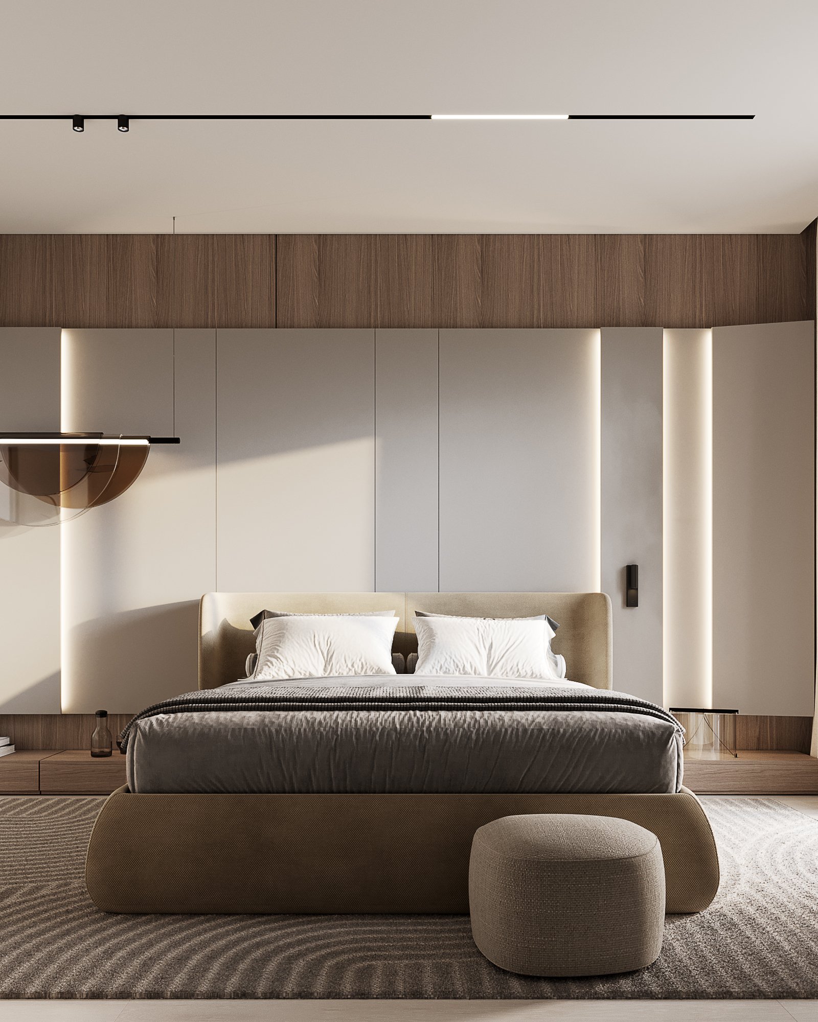 Full view of master bedroom with upholstered platform bed, ottoman, and wooden wall panels with integrated lighting.