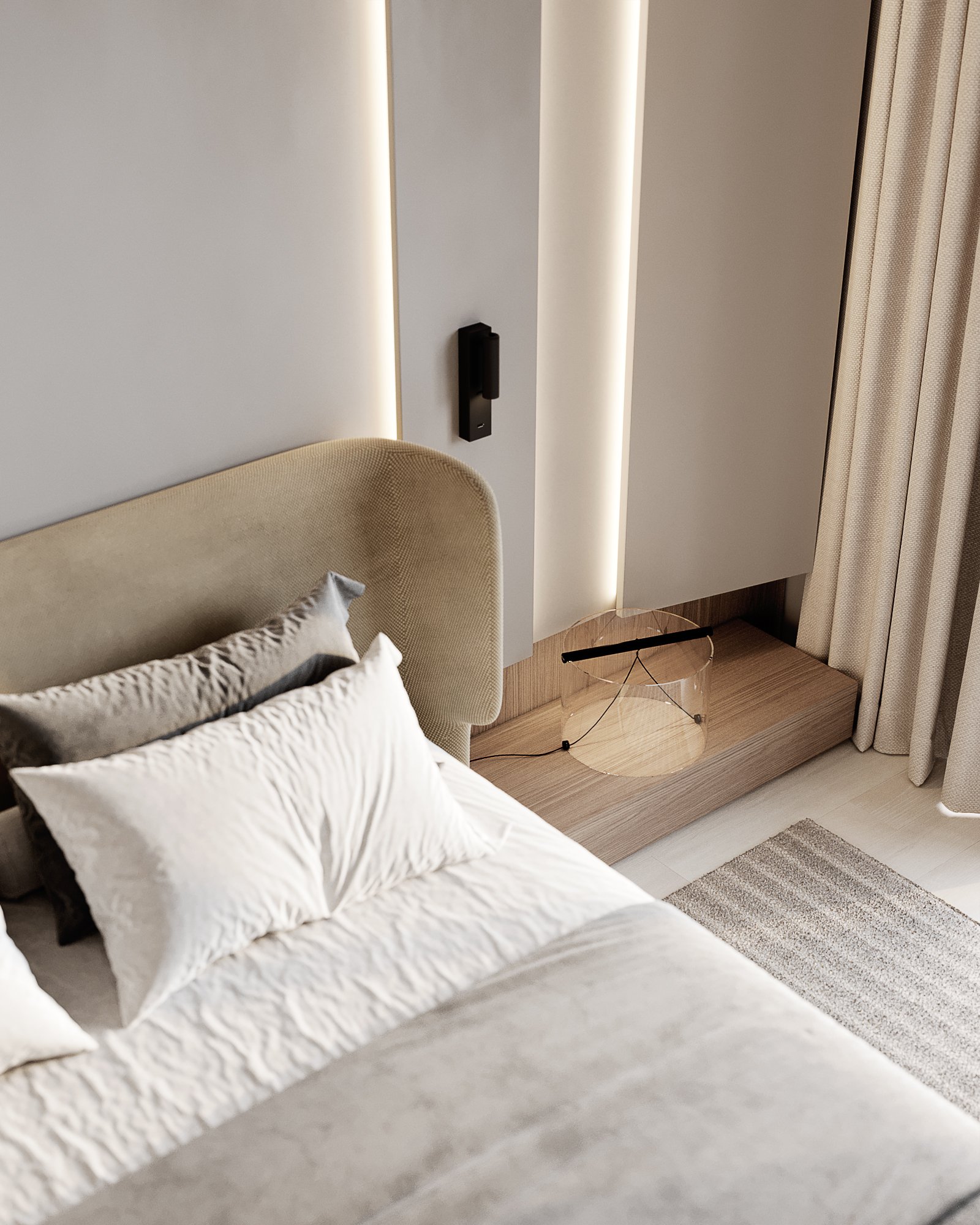 Contemporary bedroom detail featuring beige upholstered headboard, white bedding, and transparent side table.