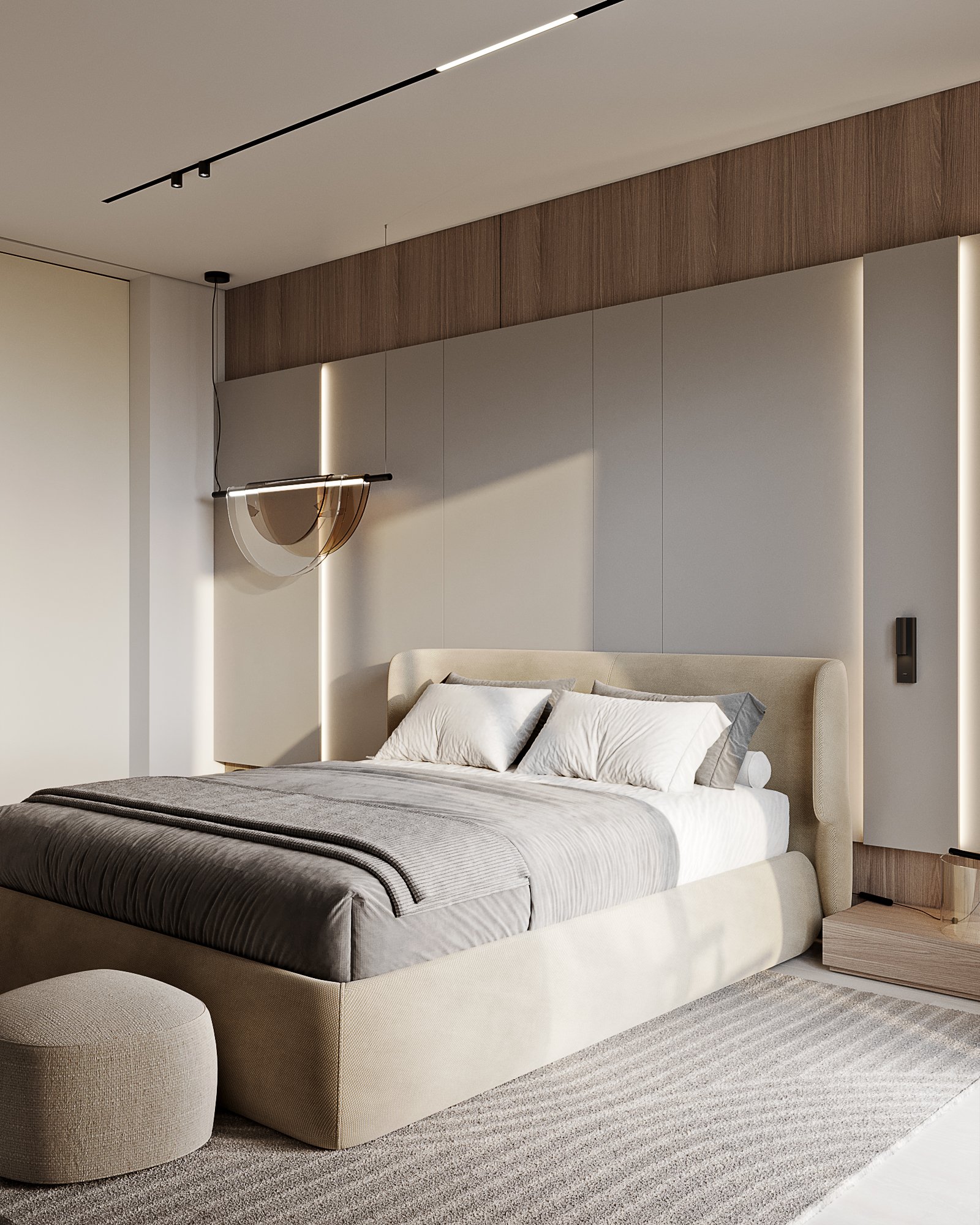 Master bedroom with upholstered bed, sculptural pendant light, and wooden wall paneling with LED lighting.