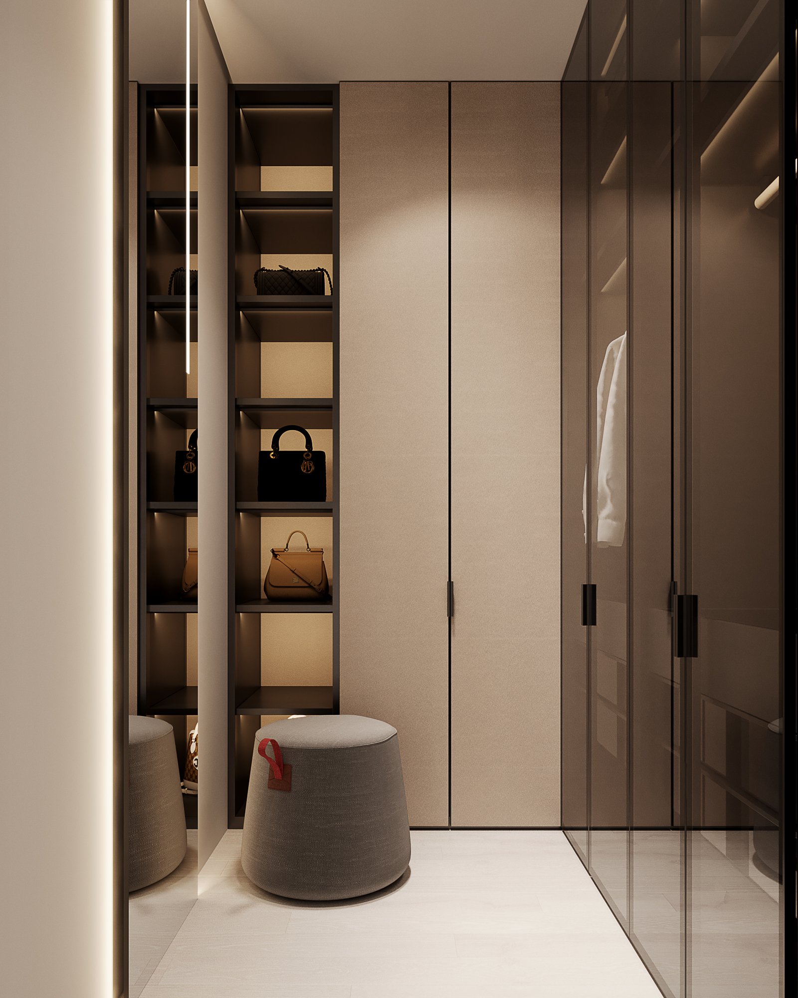 Detail of walk-in closet with illuminated display shelving for bags, grey ottoman, and floor-to-ceiling storage.