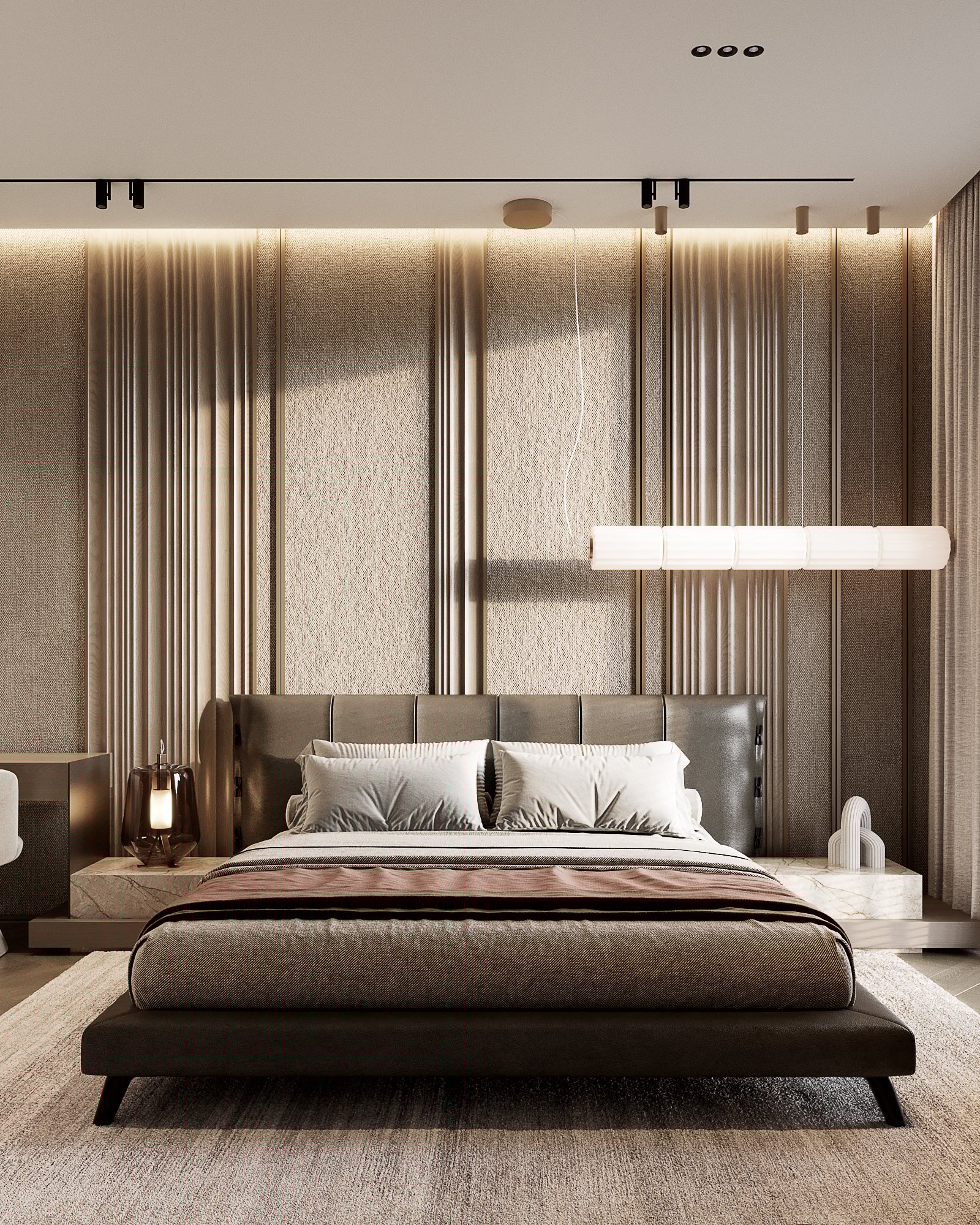 Sophisticated master bedroom with textured wall panels, suspended lighting fixture, and upholstered bed frame.