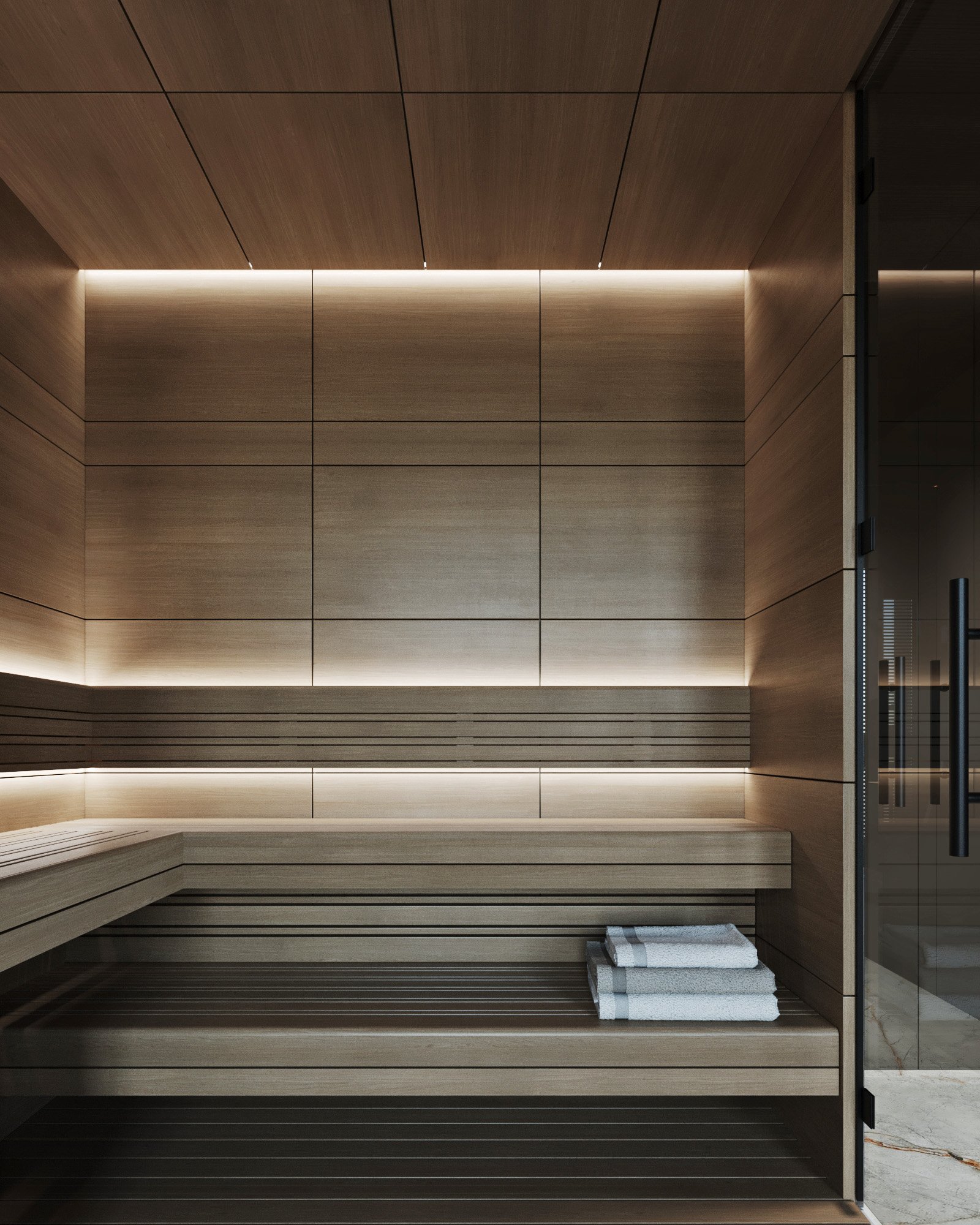 Modern sauna featuring wooden panels, built-in benches, and elegant ambient lighting.