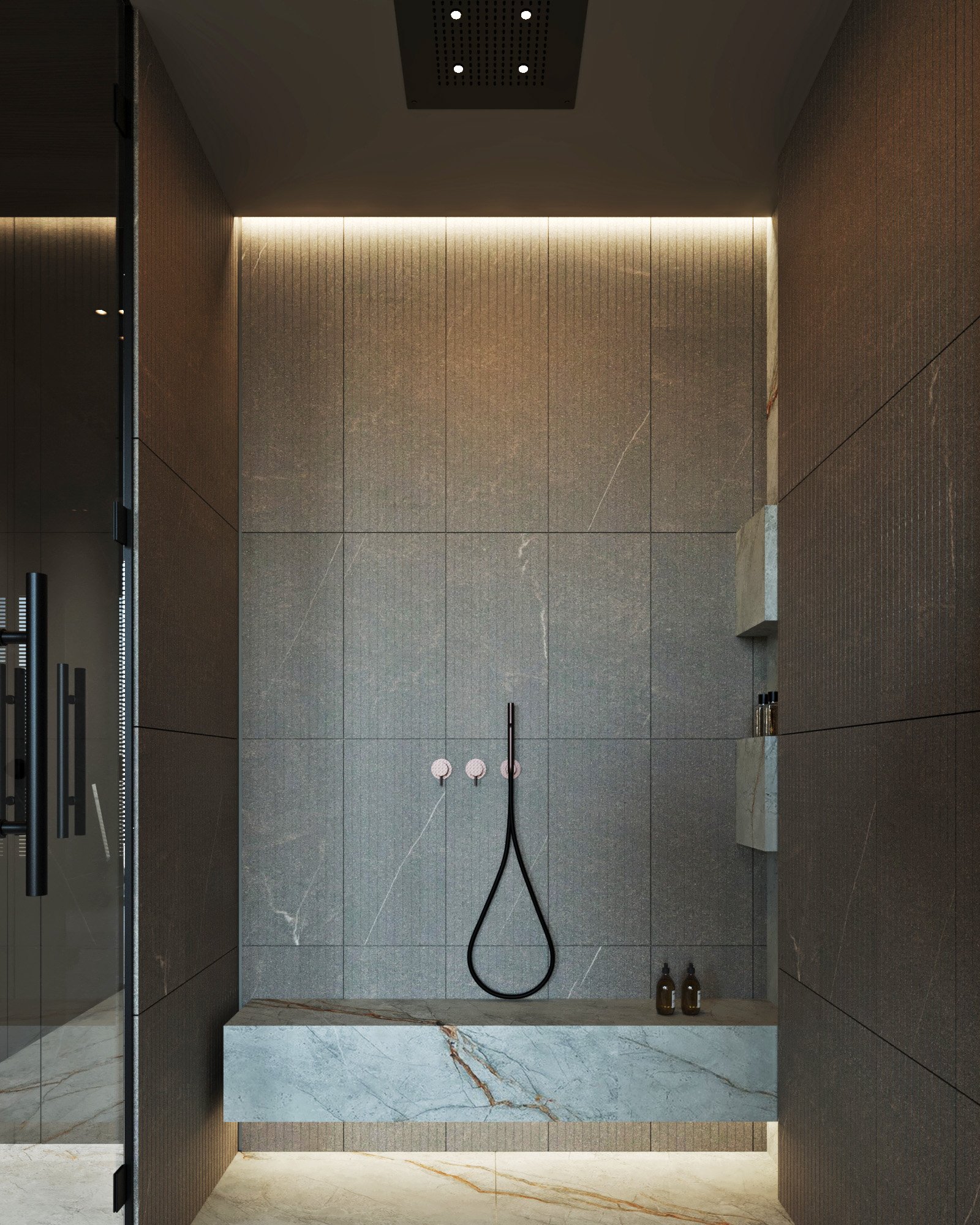 Modern shower room featuring grey stone walls, marble bench seating, and minimalist black fixtures with ambient lighting.