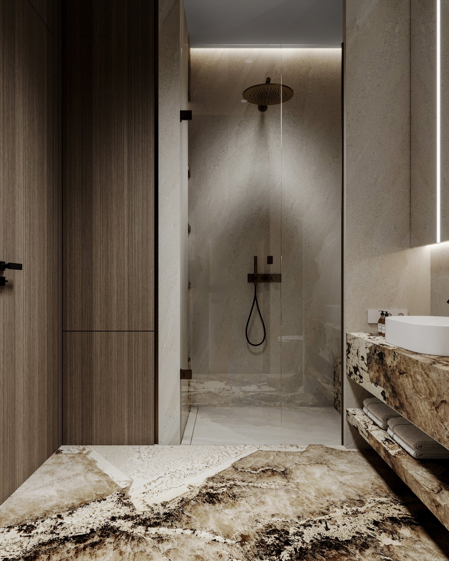 Luxury shower room with glass enclosure, rain shower head, and marble flooring with dramatic veining.