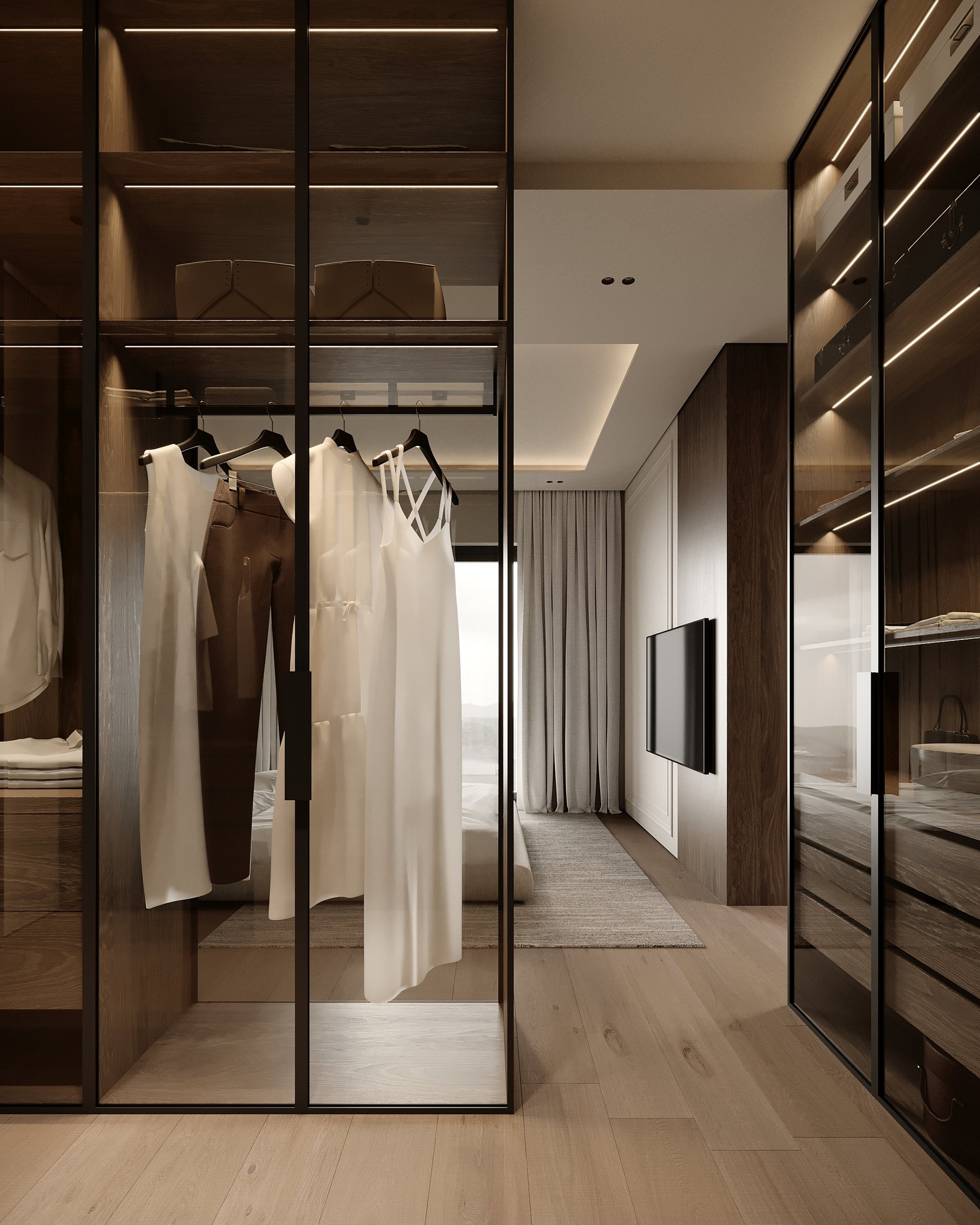 Modern walk-in closet featuring glass display cases, LED-illuminated shelving, and organized clothing storage.