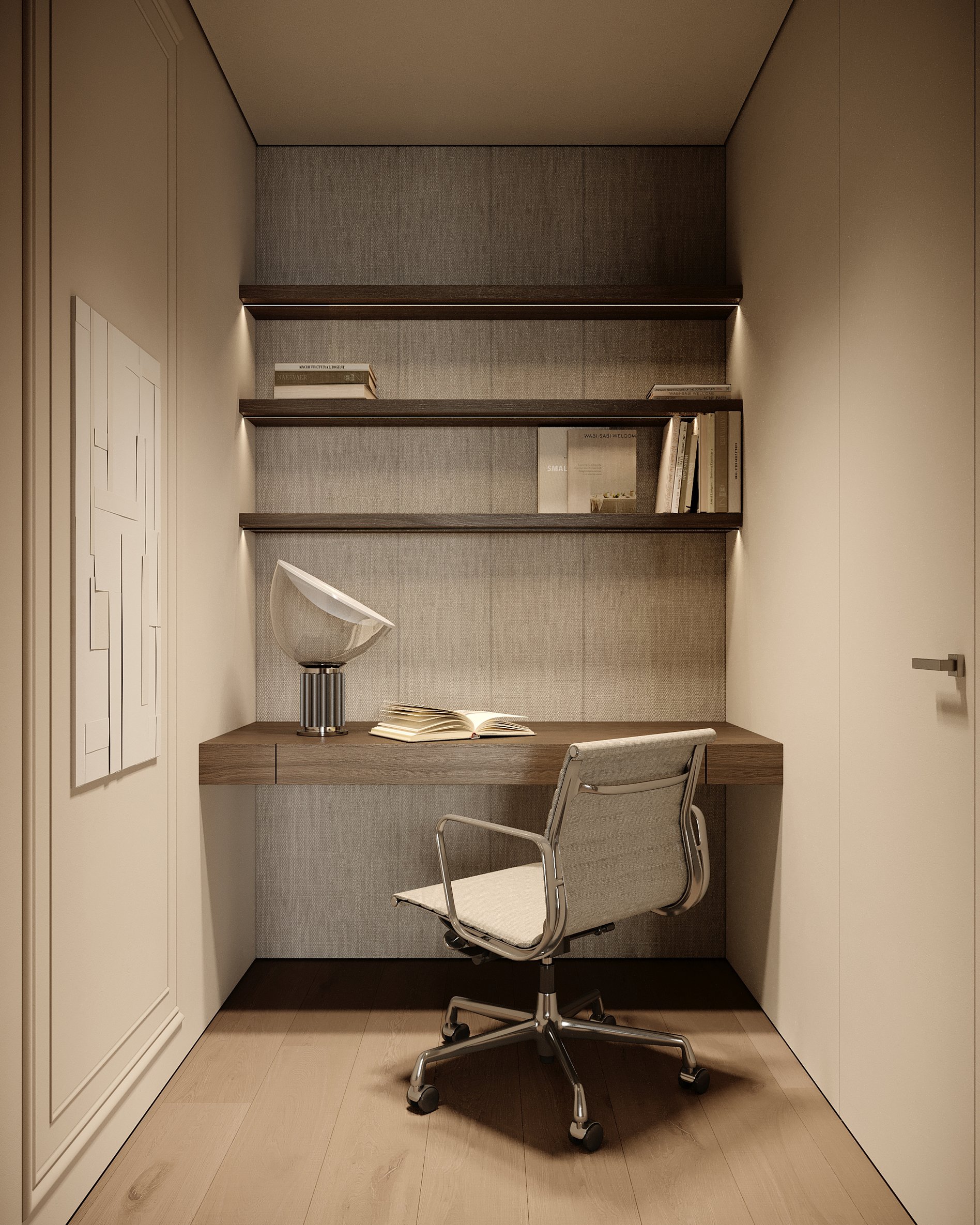 Compact home office nook with built-in desk, floating shelves, designer task chair, and abstract wall art.