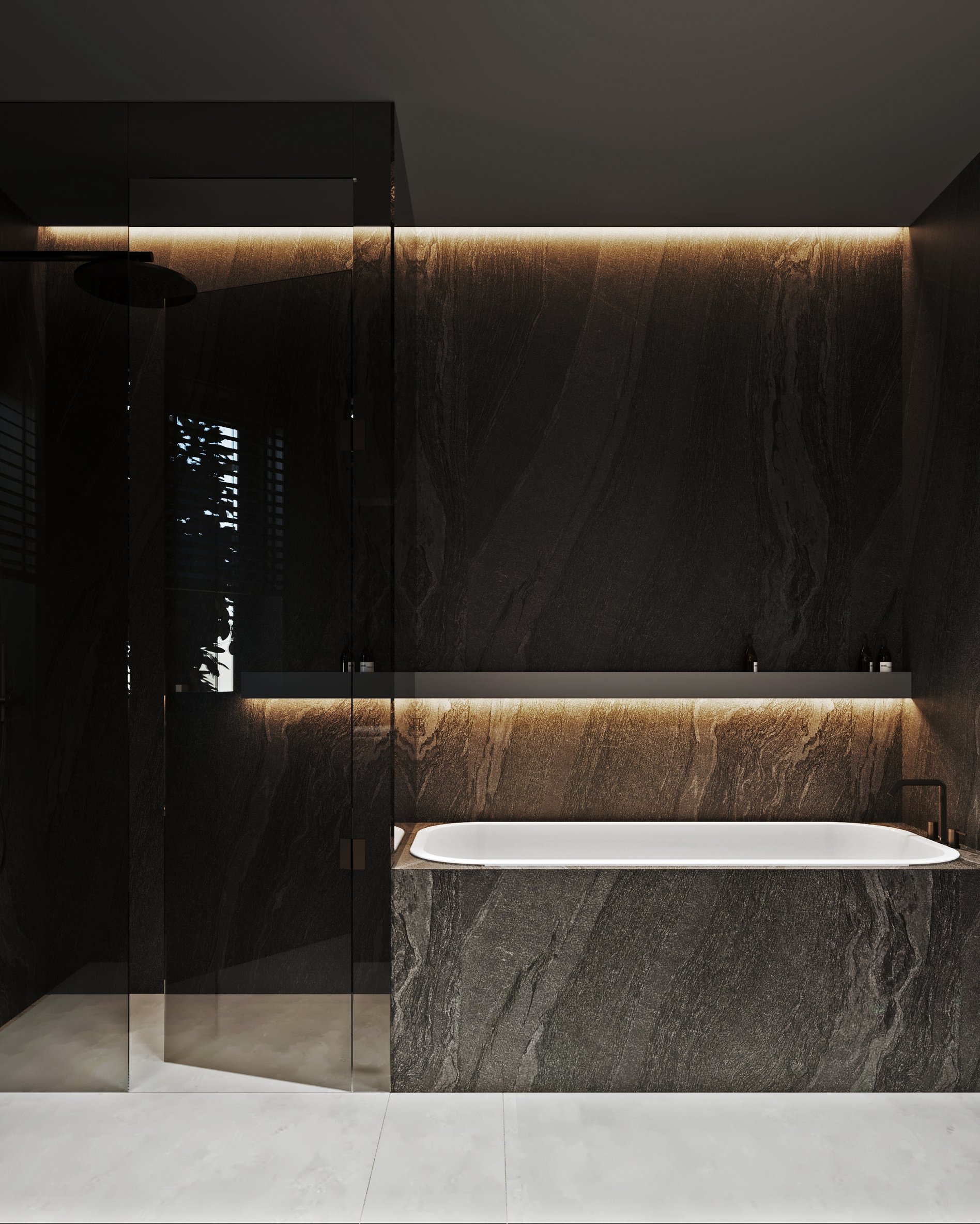 Luxury bathroom with freestanding bathtub, dark marble walls, and ambient ceiling lighting.