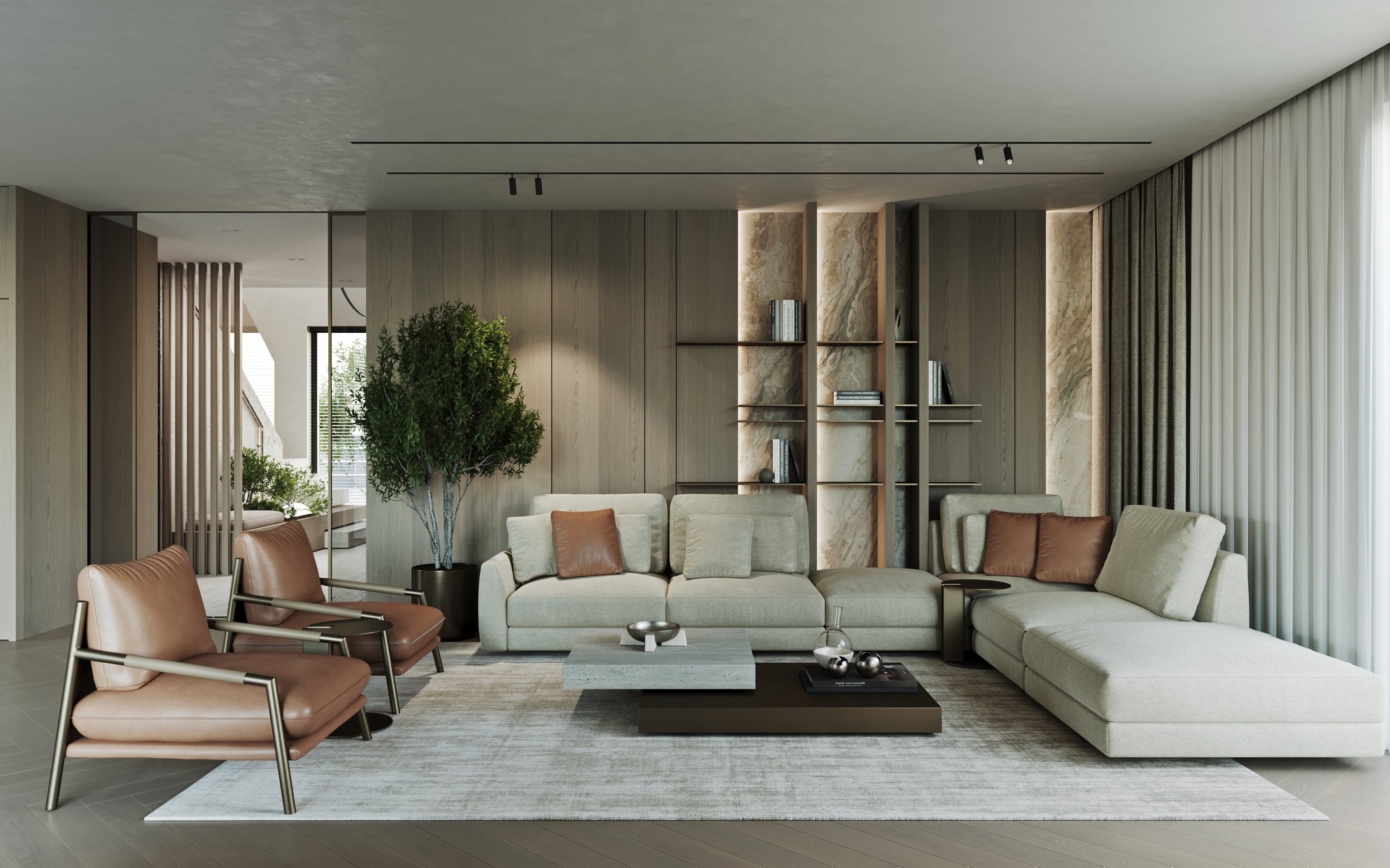 Contemporary living room featuring light grey sectional sofa, cognac leather armchairs, and marble-backed shelving with ambient lighting.