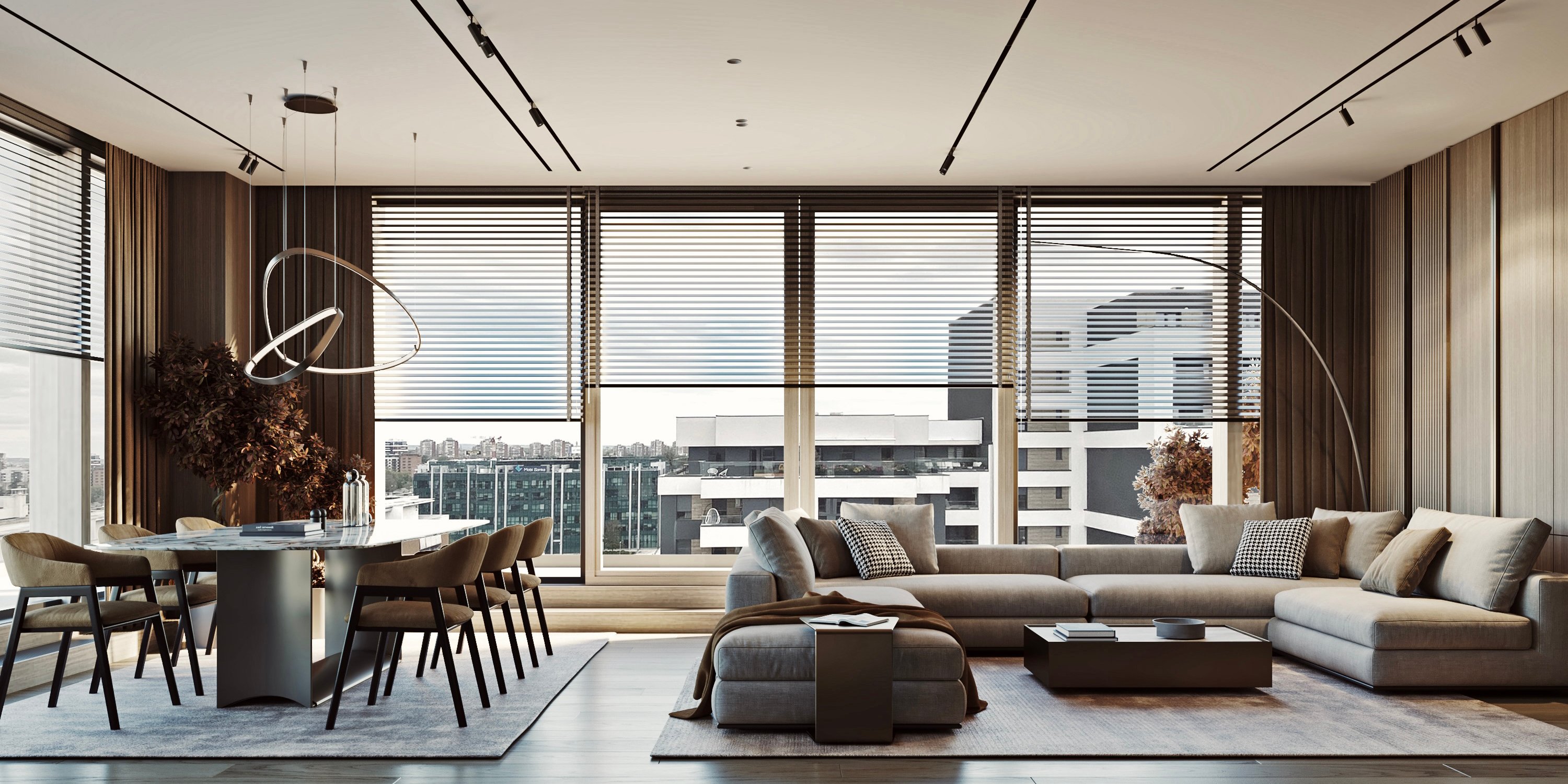 Modern living room with panoramic city views, featuring a sectional sofa, dining area, and sculptural pendant light.