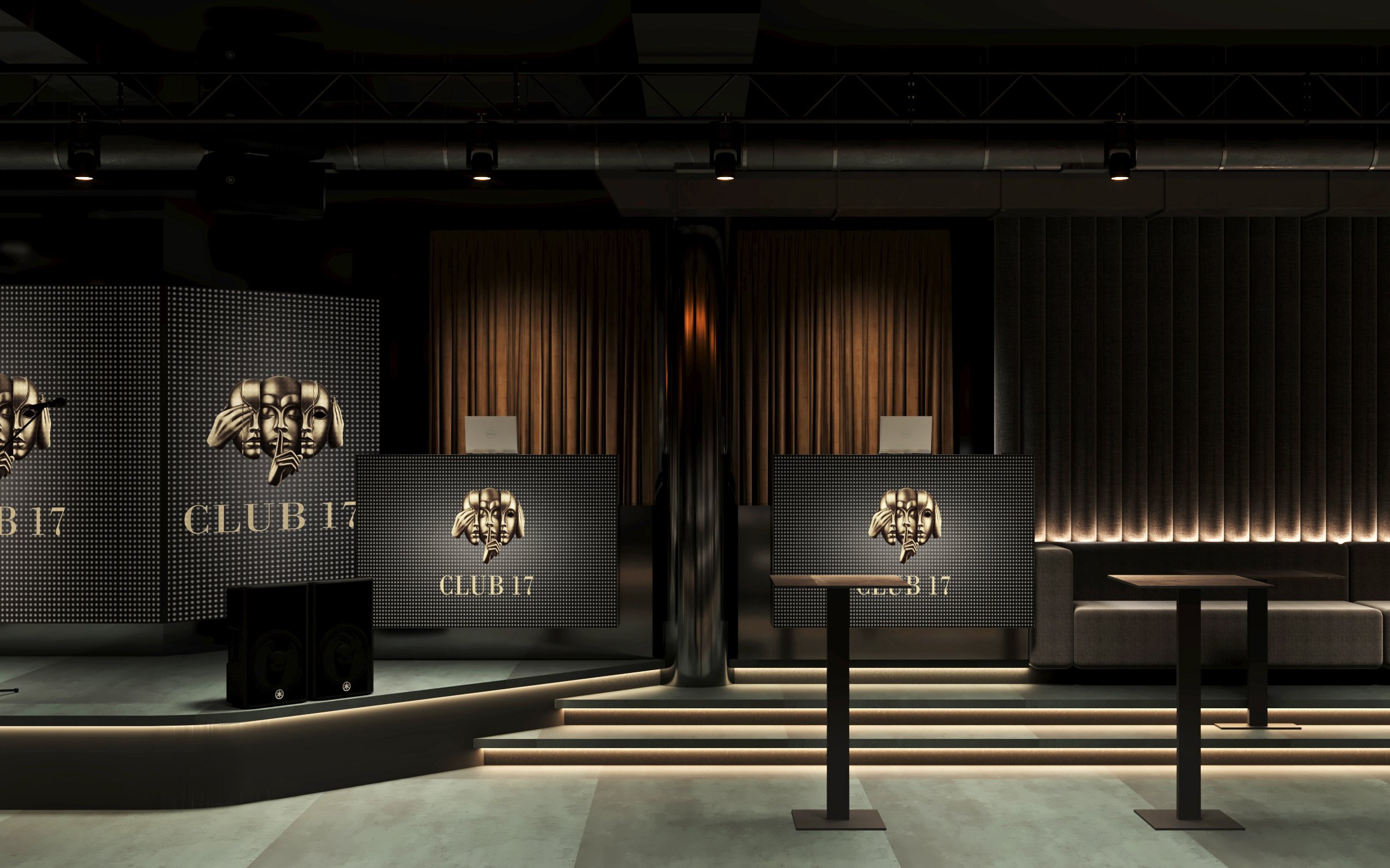 Close-up of stage area showing integrated sound system, branded display panels, and architectural lighting design.