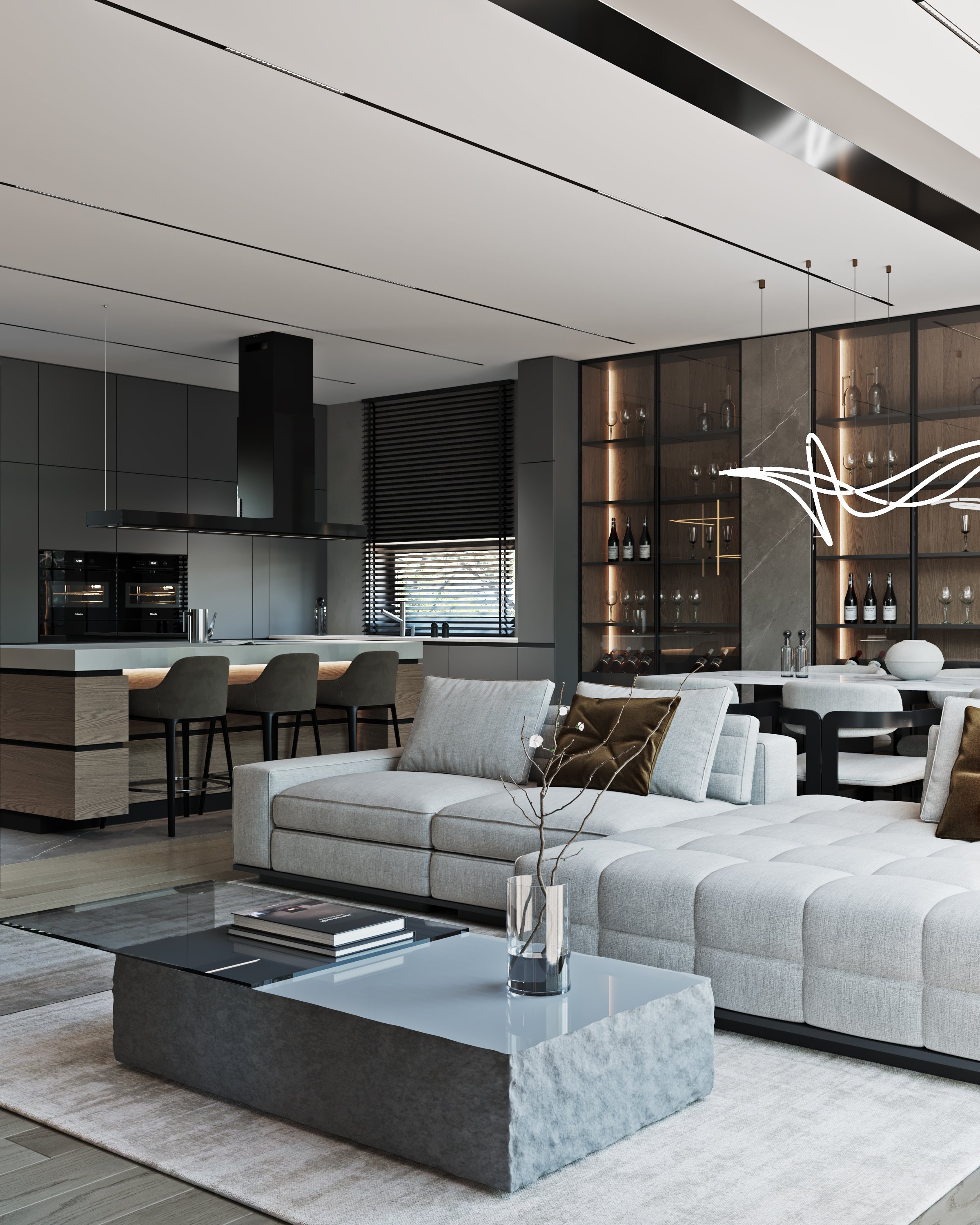 Modern open-plan living space featuring a grey sectional sofa, marble coffee table, and illuminated wine display.